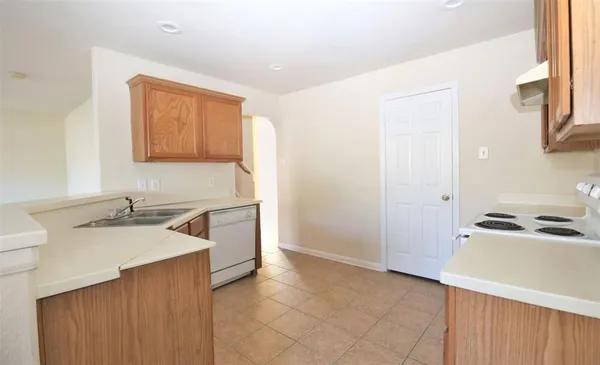 a bathroom with a sink a washer and dryer
