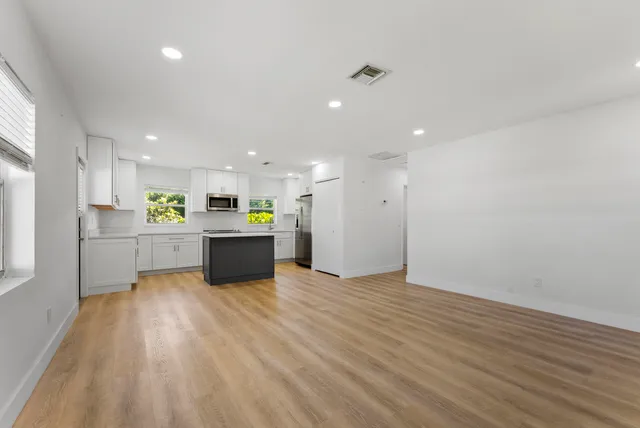 a view of kitchen with wooden floor