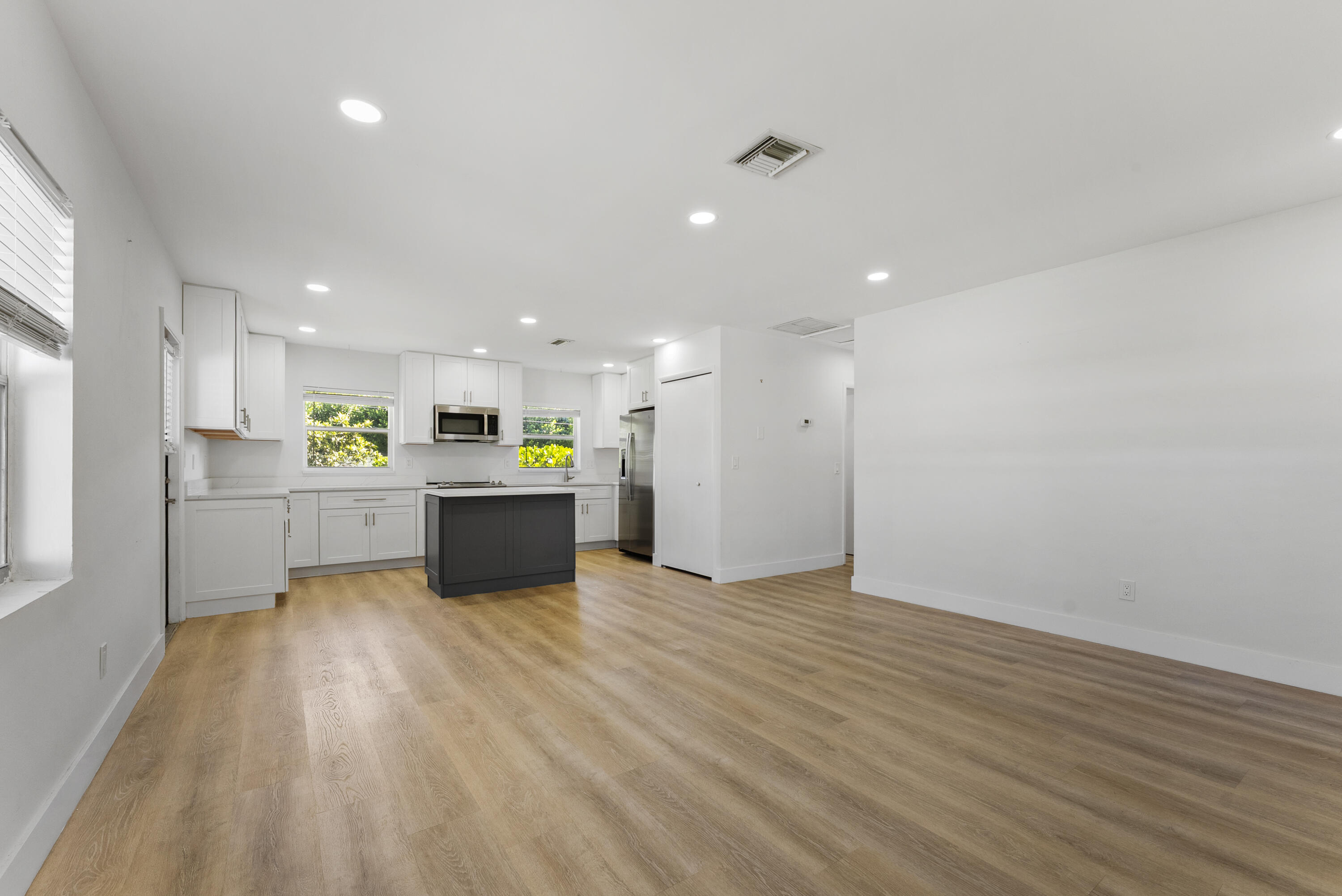 632 Allen Avenue, Unit 1 Delray Beach, FL 33483 - Photo 2 of 16 a view of kitchen with wooden floor