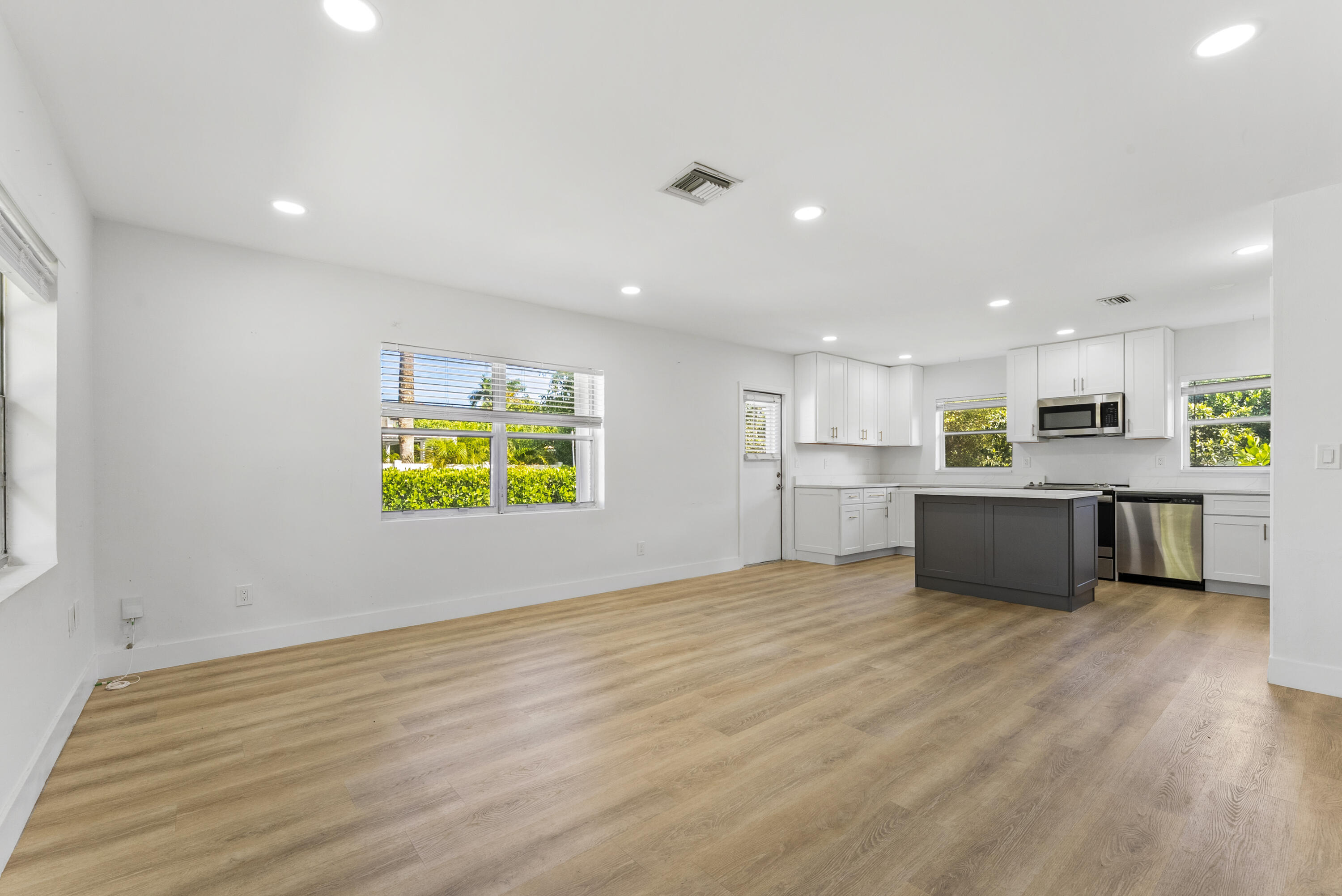 632 Allen Avenue, Unit 1 Delray Beach, FL 33483 - Photo 3 of 16 a view of kitchen with kitchen island a sink stainless steel appliances and cabinets