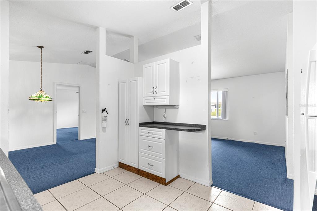 9840 Southwest 63rd Court Ocala, FL 34476 - Photo 24 of 49 a kitchen with stainless steel appliances granite countertop a refrigerator and a sink