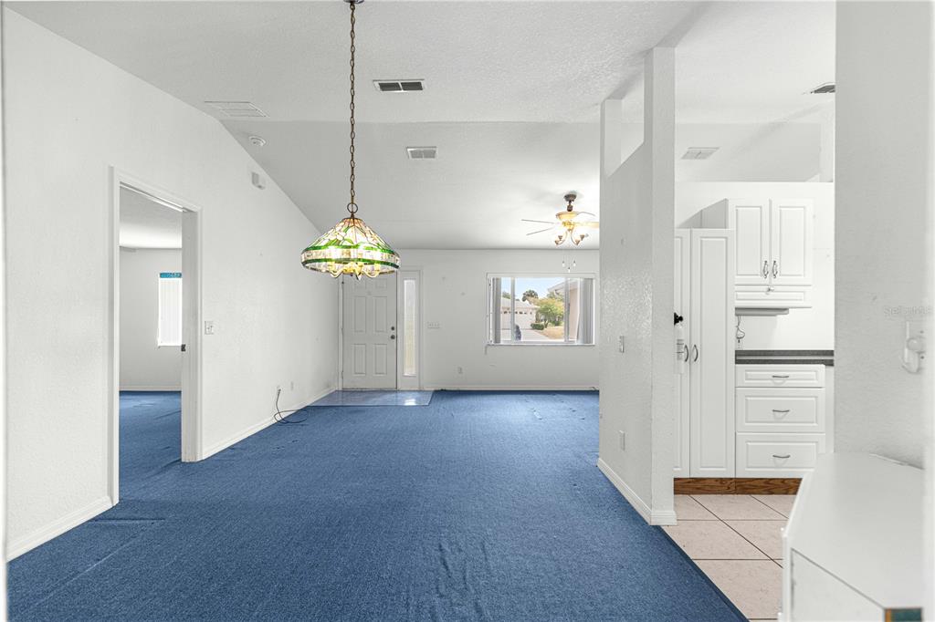 9840 Southwest 63rd Court Ocala, FL 34476 - Photo 3 of 49 a view of an entryway with wooden floor