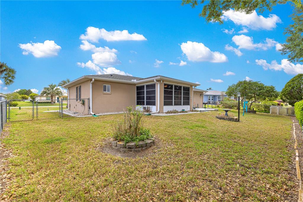 9840 Southwest 63rd Court Ocala, FL 34476 - Photo 34 of 49 a view of a house with a yard
