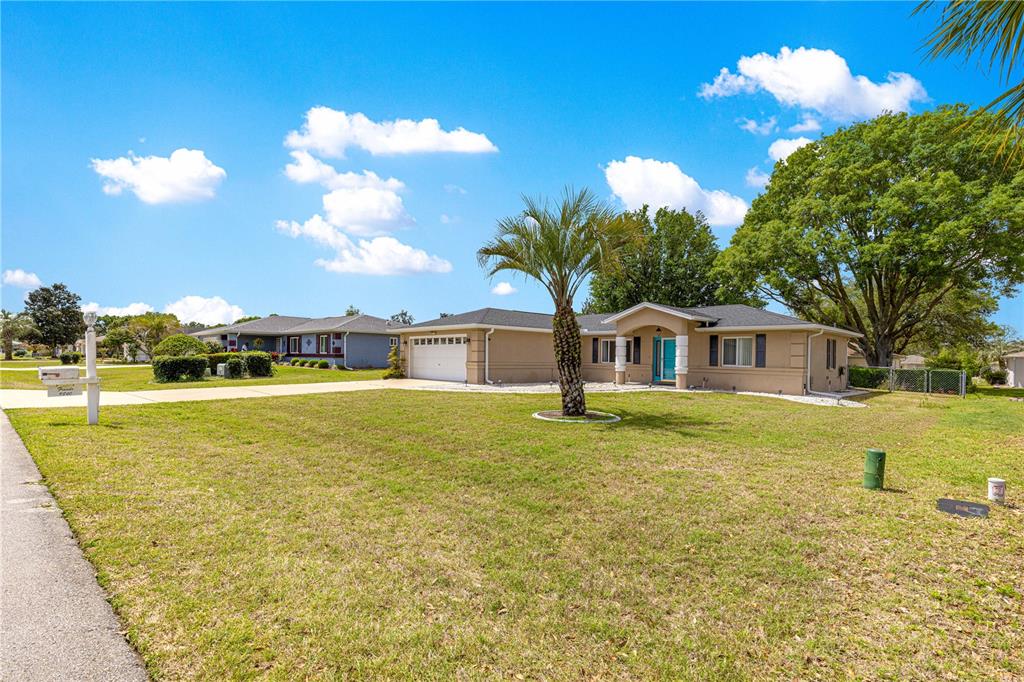 9840 Southwest 63rd Court Ocala, FL 34476 - Photo 40 of 49 a view of a house with a yard