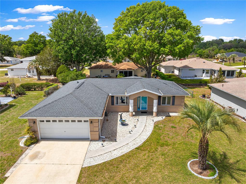 9840 Southwest 63rd Court Ocala, FL 34476 - Photo 43 of 49 a front view of a house with garden
