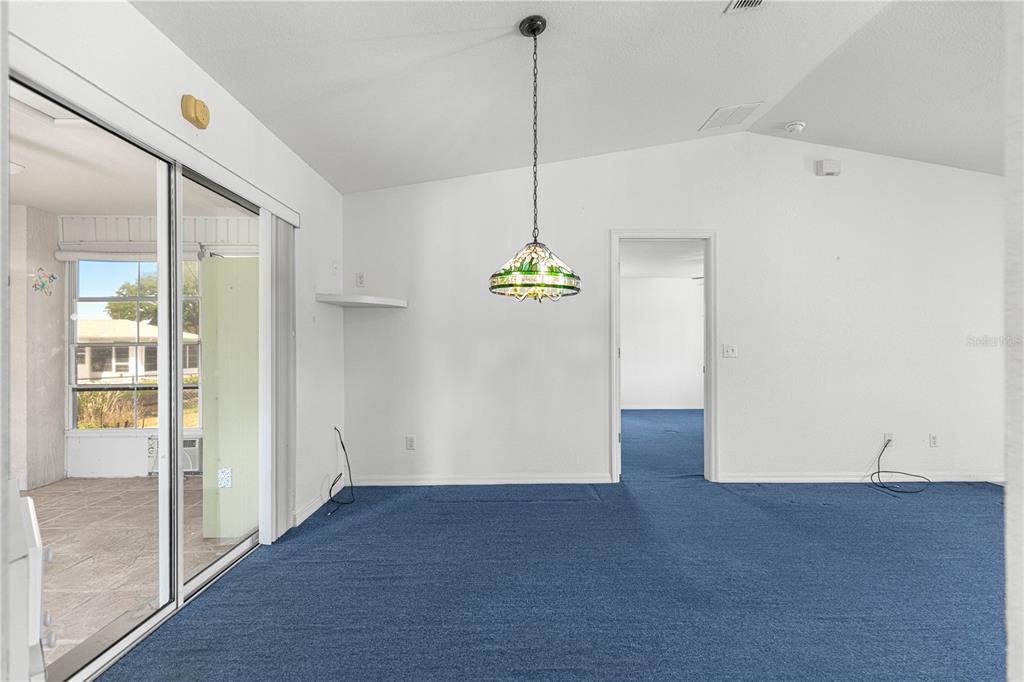 9840 Southwest 63rd Court Ocala, FL 34476 - Photo 6 of 49 a view interior of a house an entryway and chandelier fan