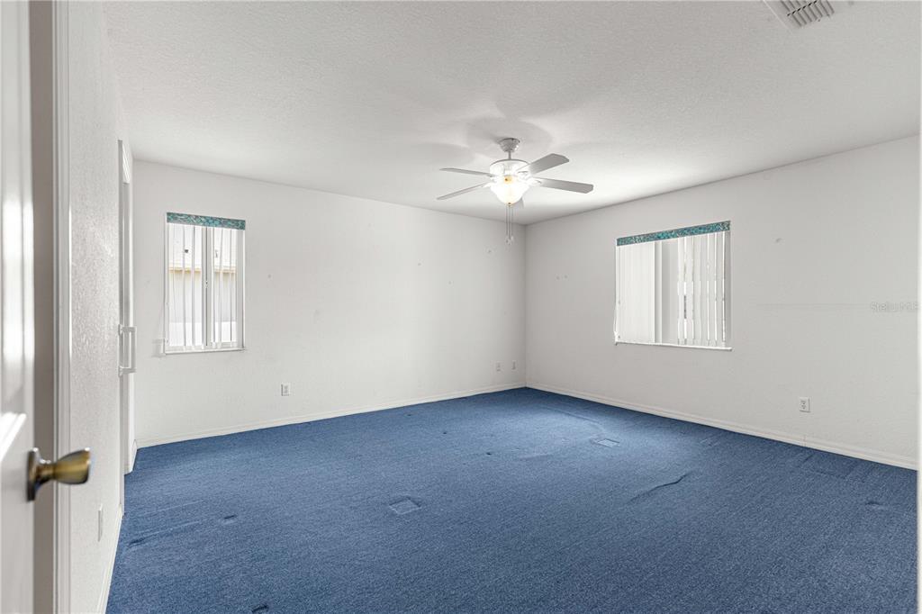 9840 Southwest 63rd Court Ocala, FL 34476 - Photo 7 of 49 a view of an empty room with a window