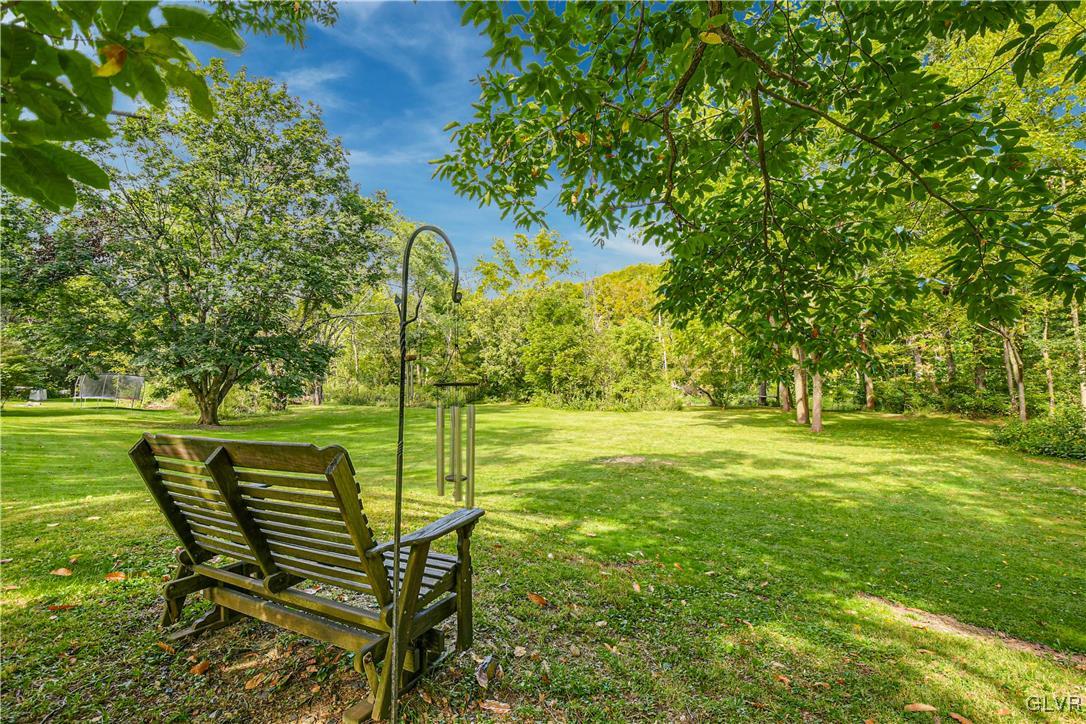 281 Old Furnace Road Riegelsville, PA 18077 - Photo 23 of 29 a view of a bench in the garden near a lake