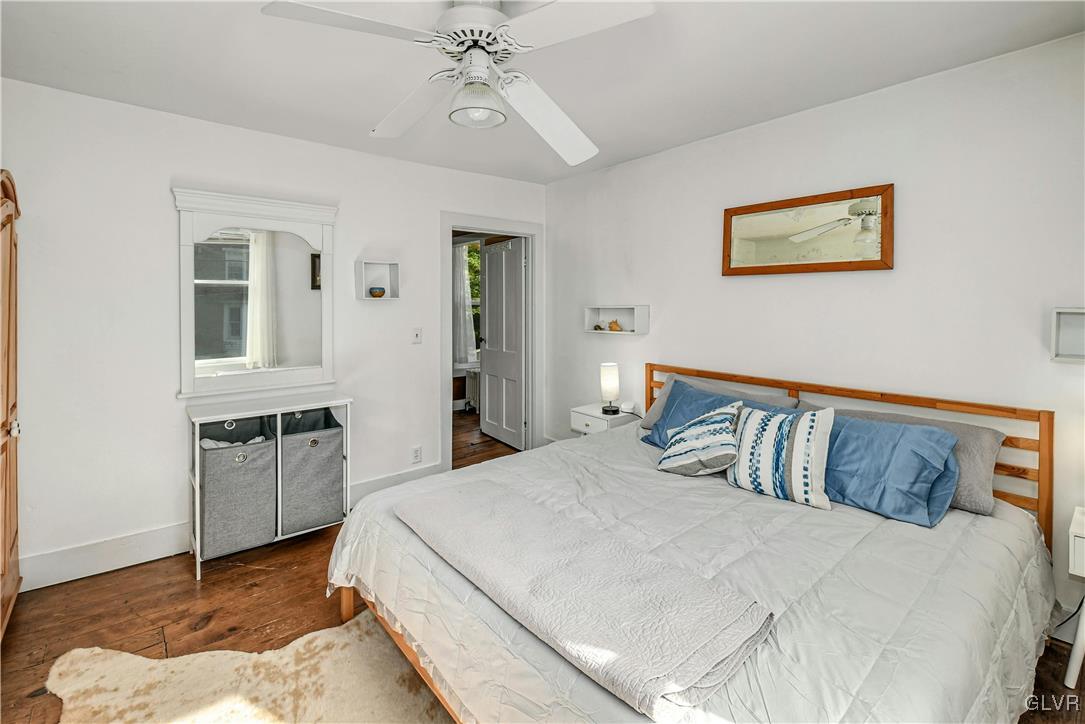 281 Old Furnace Road Riegelsville, PA 18077 - Photo 10 of 29 a bedroom with a large bed and a chandelier