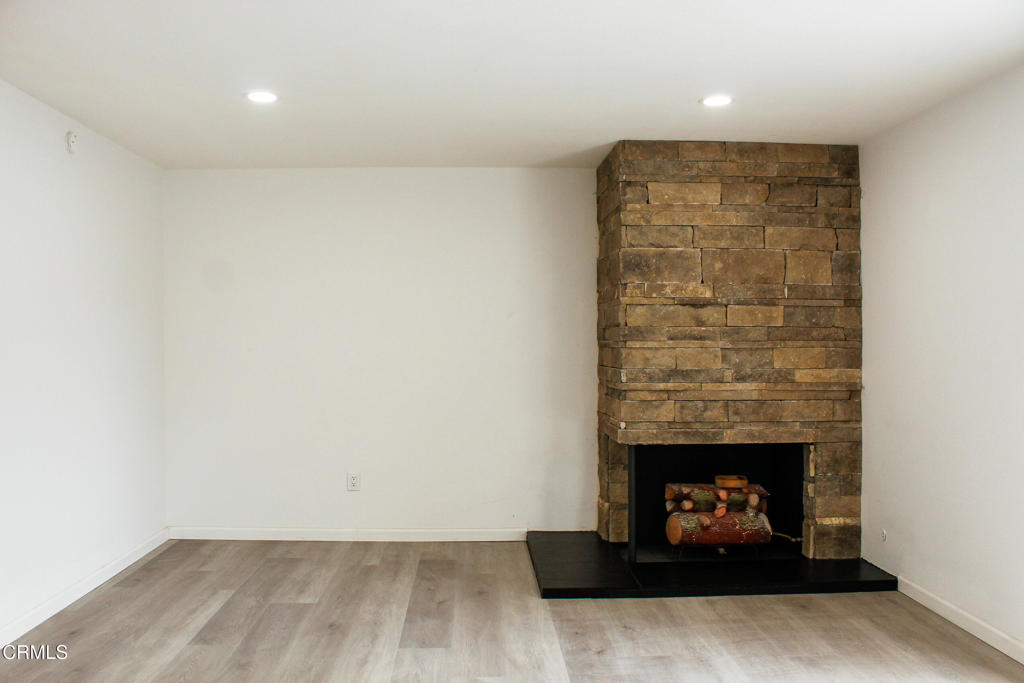 1430 Huntswood Way Oxnard, CA 93030 - Photo 4 of 14 a living room with furniture and a fireplace