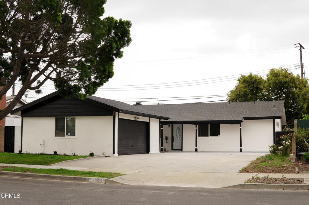 1430 Huntswood Way Oxnard, CA 93030 - Photo 5 of 14 a front view of a house with a yard