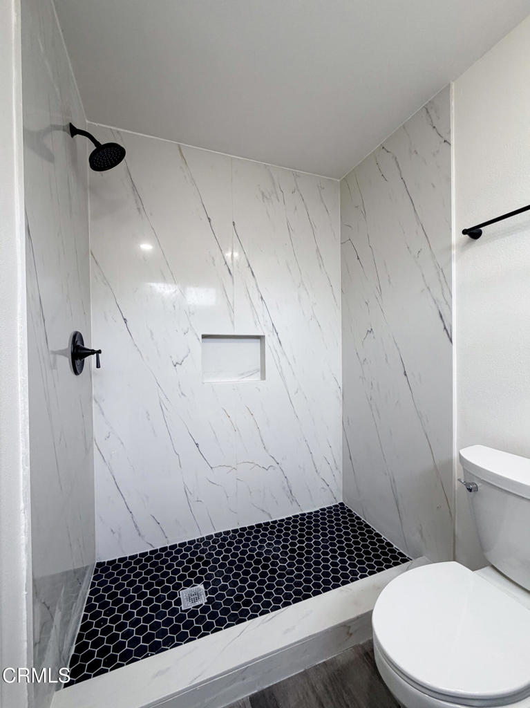 1430 Huntswood Way Oxnard, CA 93030 - Photo 6 of 14 a bathroom with a toilet a sink and a shower