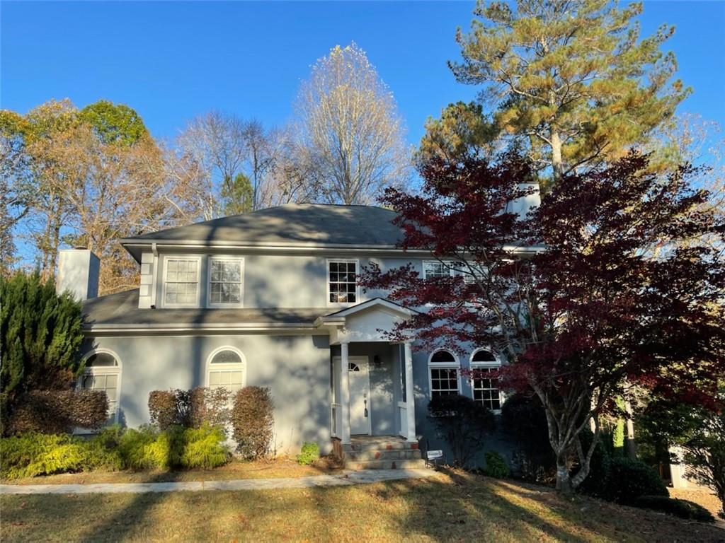 1674 Niskey Lake Road Southwest Atlanta, GA 30331 - Photo 1 of 1 a front view of a house with a yard and garage