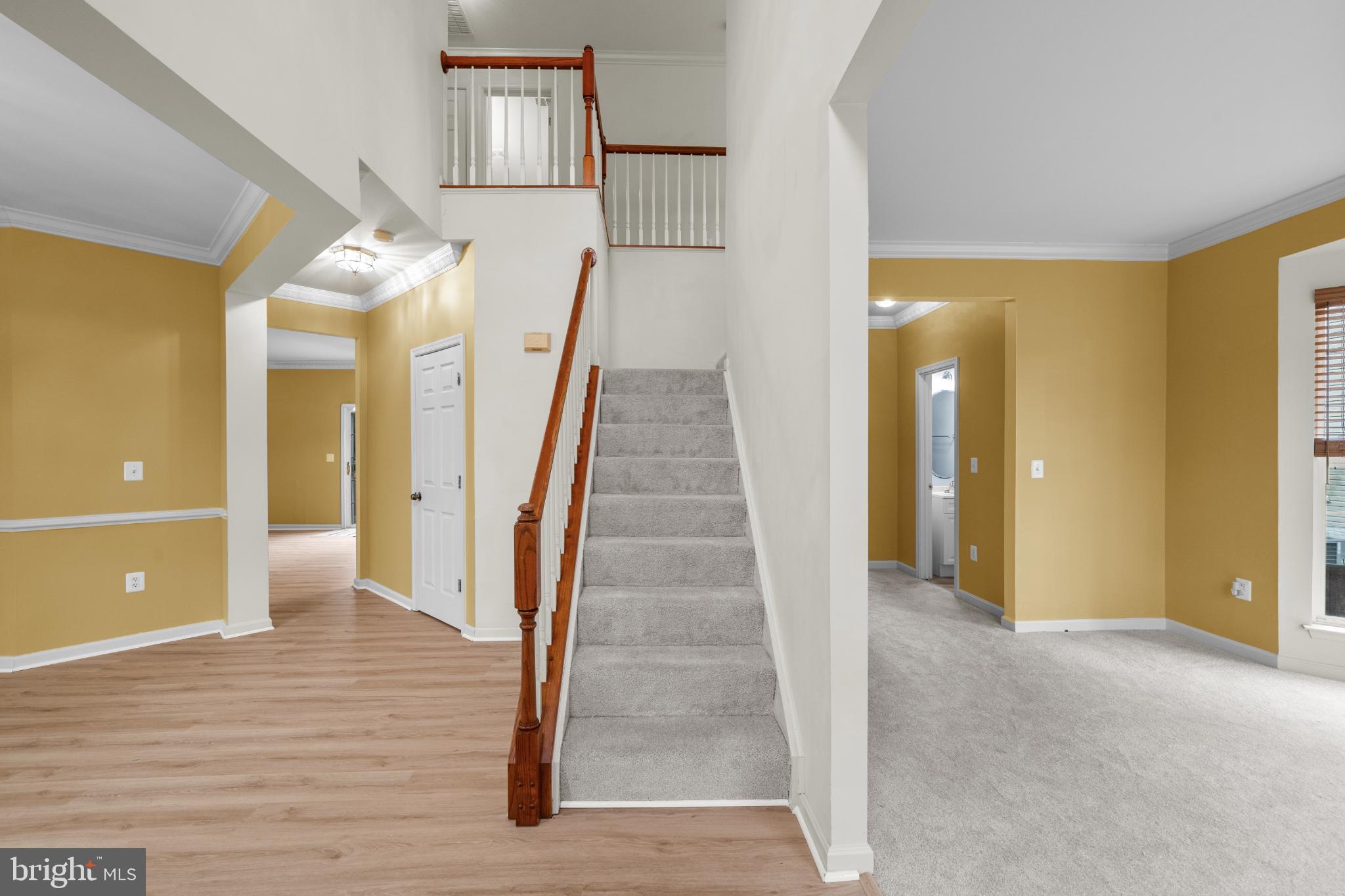 15381 Tina Lane Woodbridge, VA 22193 - Photo 2 of 32 a view of a hallway view with wooden floor and staircase