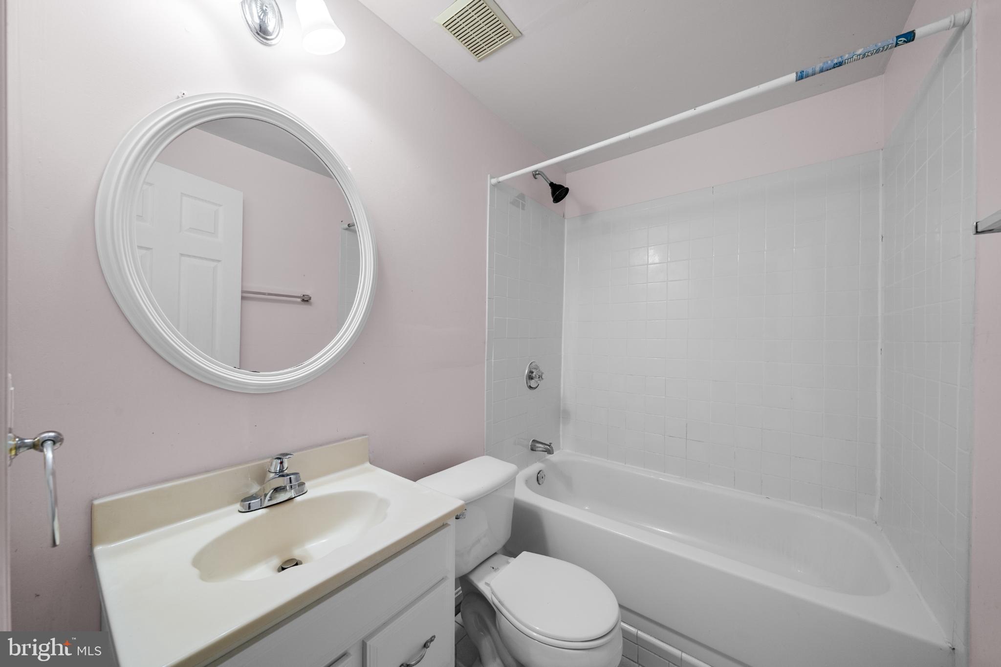 15381 Tina Lane Woodbridge, VA 22193 - Photo 30 of 32 a bathroom with a sink toilet and shower