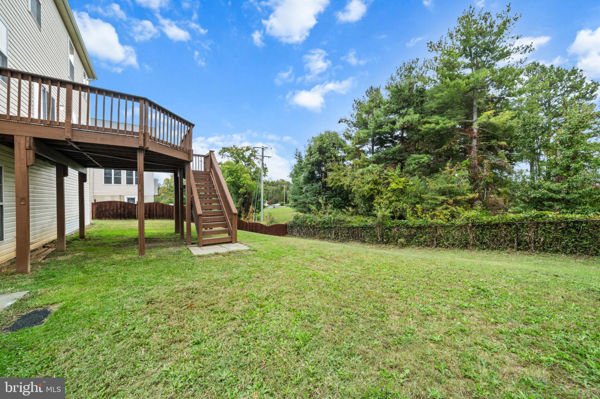 15381 Tina Lane Woodbridge, VA 22193 - Photo 31 of 32 a view of a house with a backyard