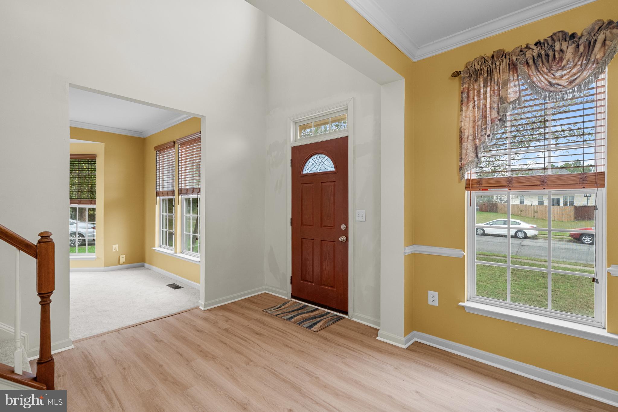 15381 Tina Lane Woodbridge, VA 22193 - Photo 4 of 32 a view of an empty room with wooden floor and a window