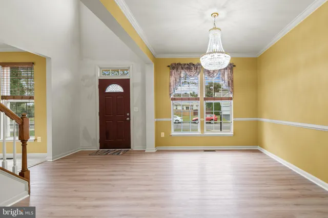 a view of livingroom with hardwood floor and door