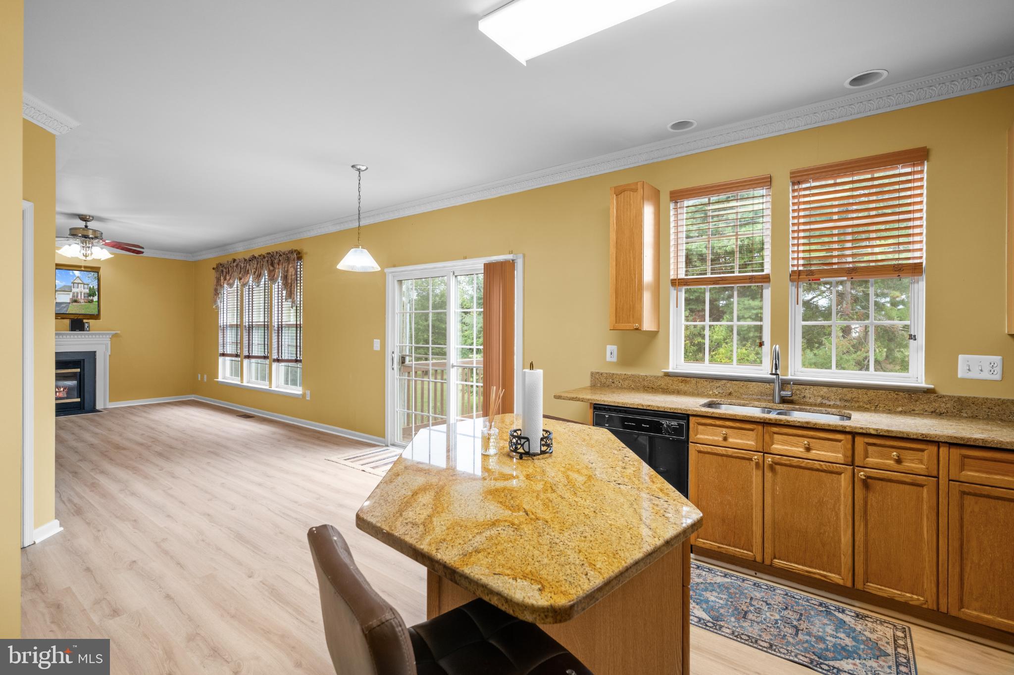 15381 Tina Lane Woodbridge, VA 22193 - Photo 9 of 32 a kitchen with stainless steel appliances granite countertop a stove a sink and a refrigerator