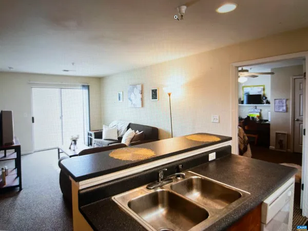 a room with pool table and windows