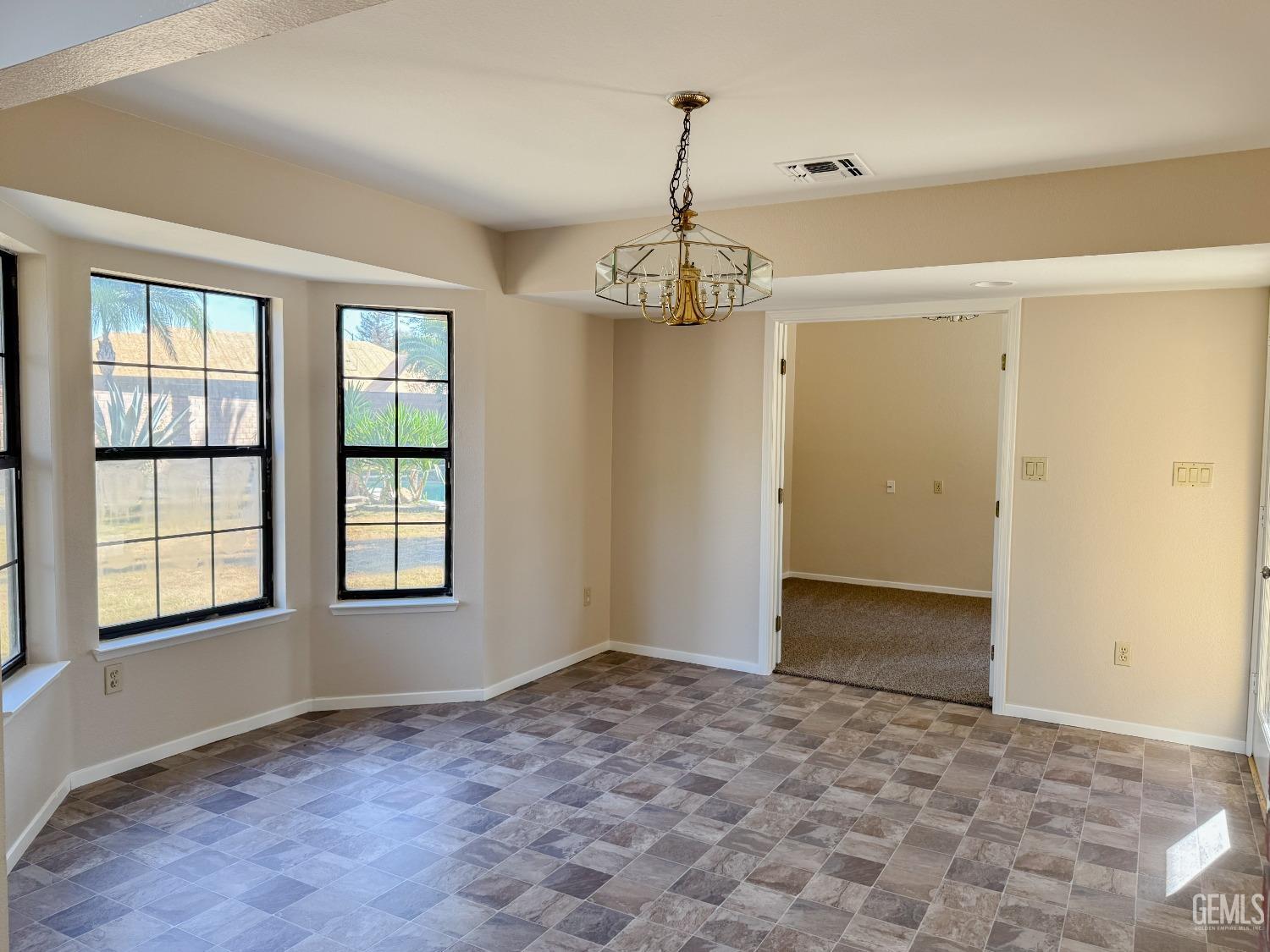 Undisclosed Address Bakersfield, CA 93307 - Photo 16 of 46 a view of an empty room with a window