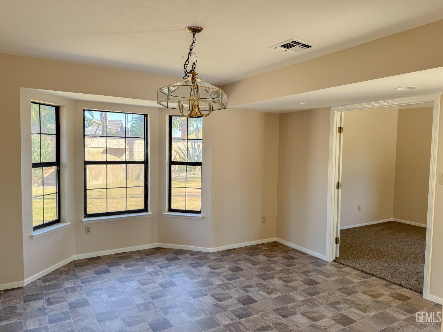 Undisclosed Address Bakersfield, CA 93307 - Photo 17 of 46 a view of an empty room with a window