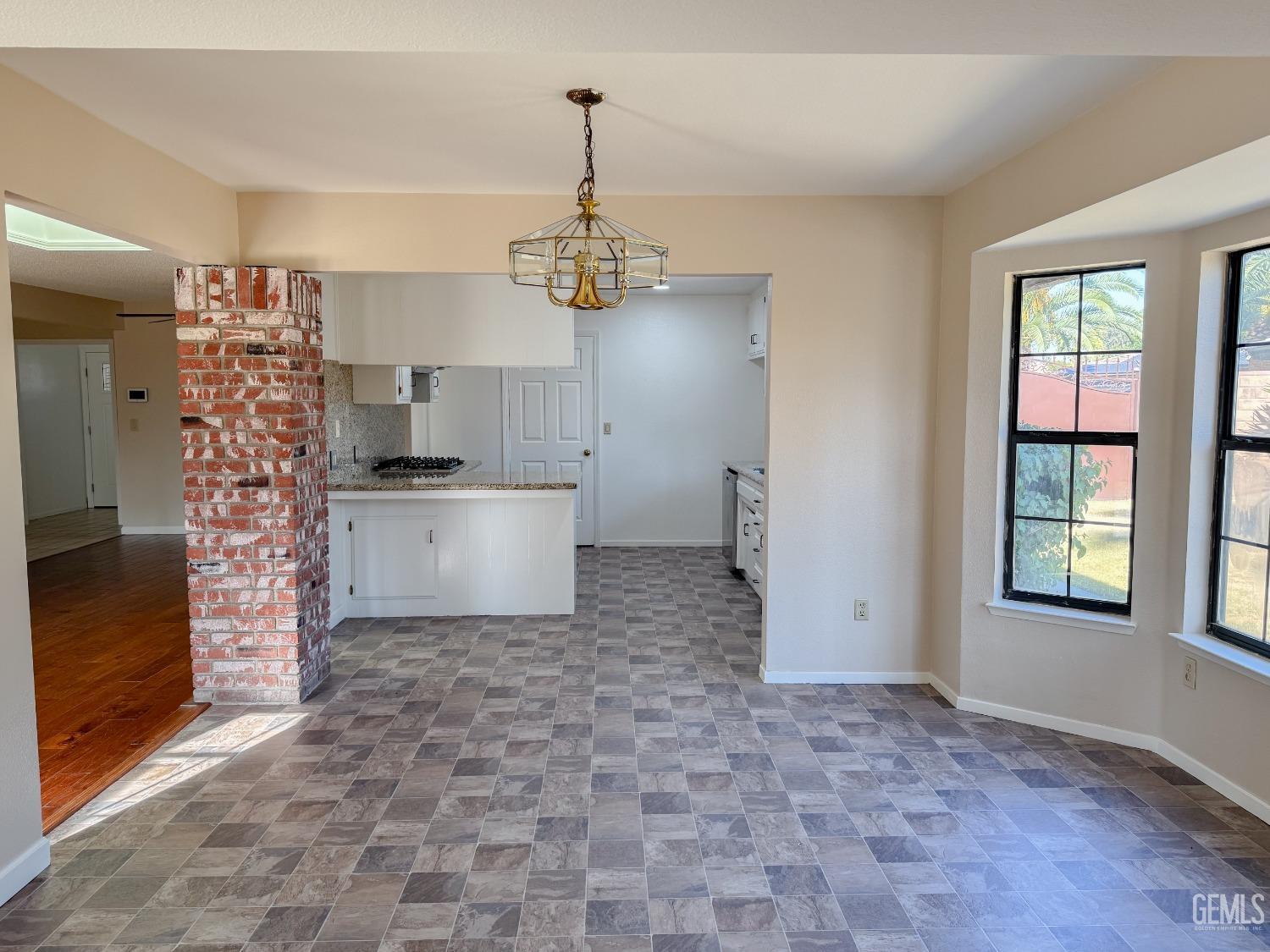 Undisclosed Address Bakersfield, CA 93307 - Photo 18 of 46 a view of a kitchen with a sink and a window