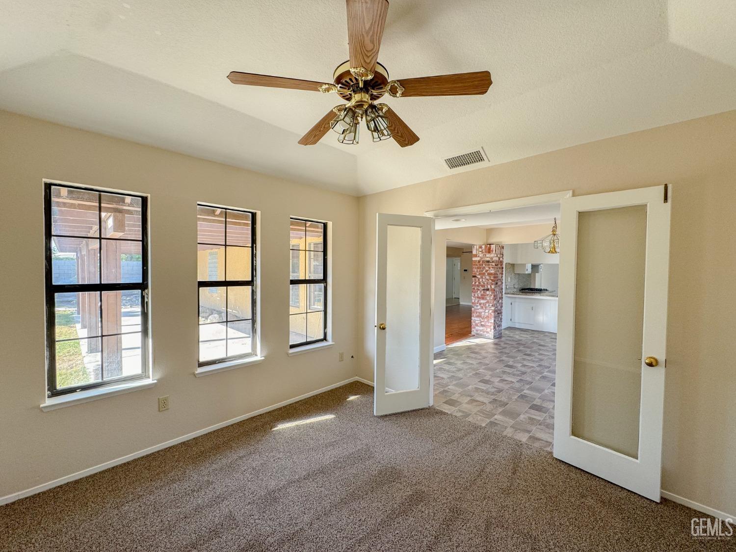 Undisclosed Address Bakersfield, CA 93307 - Photo 20 of 46 a view of an empty room with a window