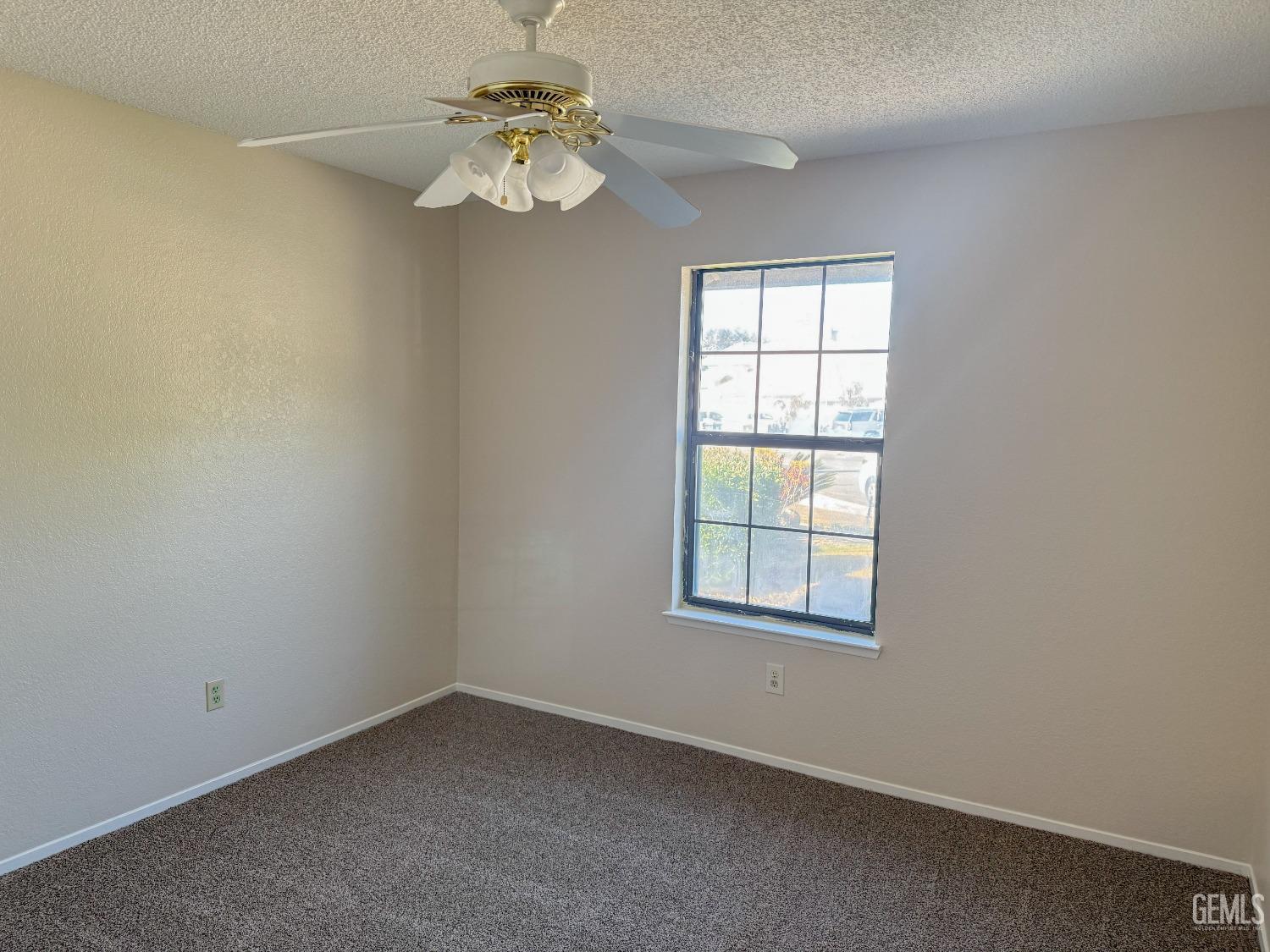 Undisclosed Address Bakersfield, CA 93307 - Photo 27 of 46 an empty room with a window and a fan