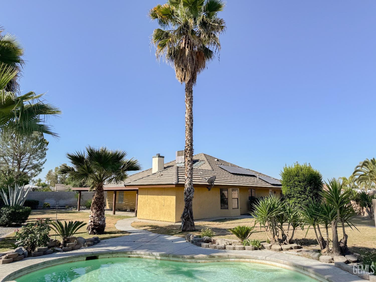 Undisclosed Address Bakersfield, CA 93307 - Photo 30 of 46 a front view of a house with yard