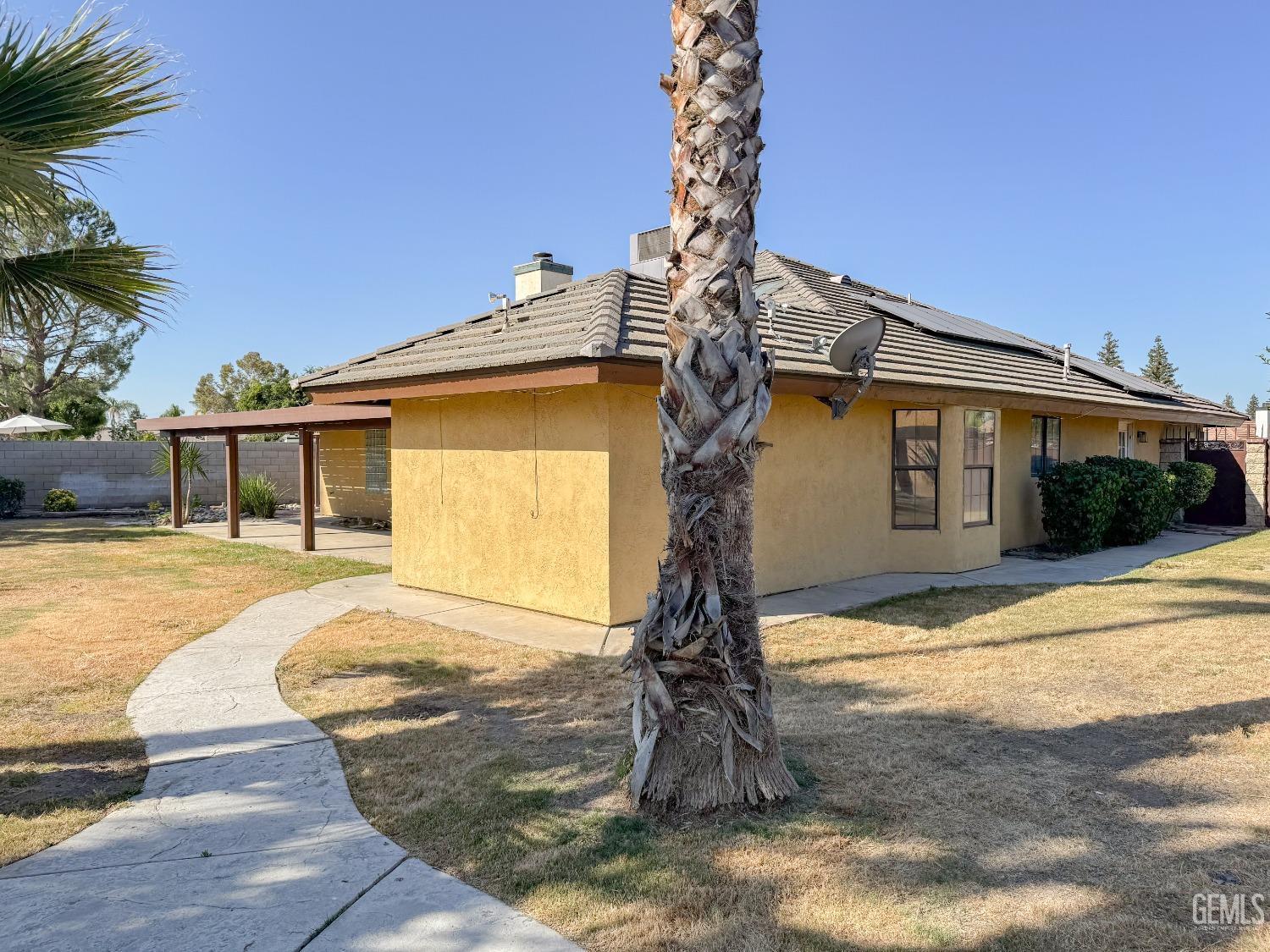 Undisclosed Address Bakersfield, CA 93307 - Photo 31 of 46 a front view of a house with garden