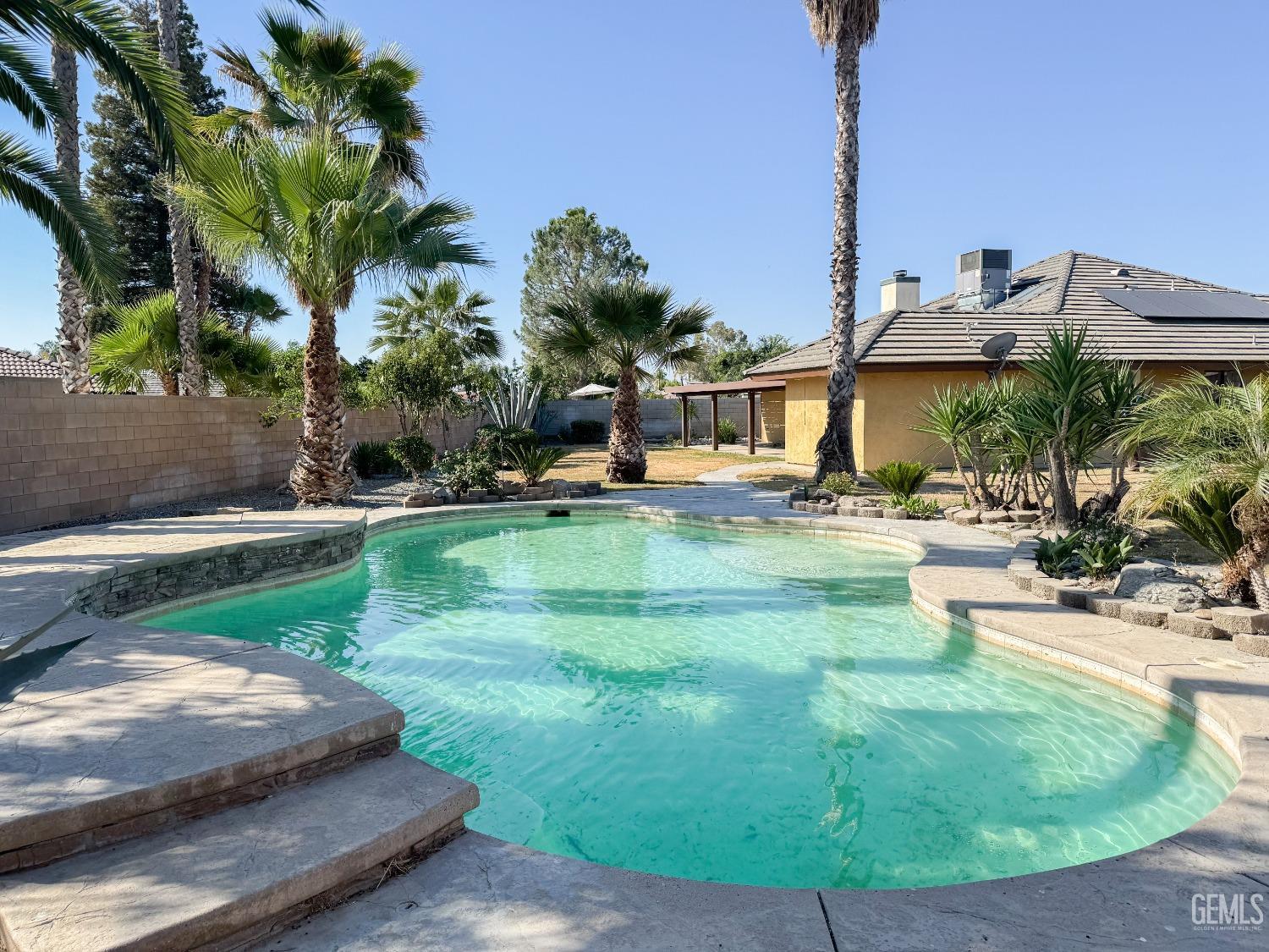 Undisclosed Address Bakersfield, CA 93307 - Photo 33 of 46 a view of a swimming pool with a patio