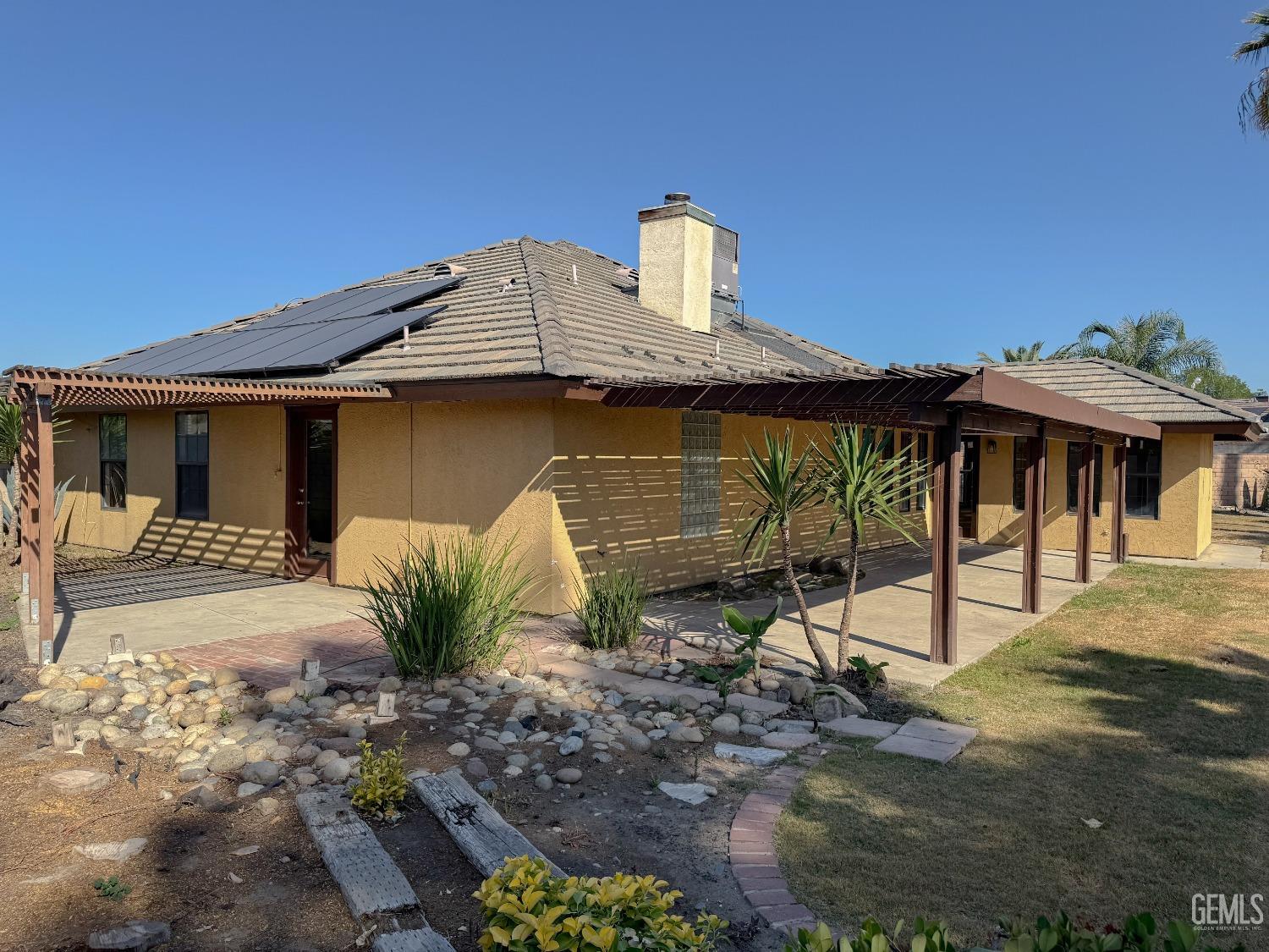 Undisclosed Address Bakersfield, CA 93307 - Photo 40 of 46 a front view of a house with garden