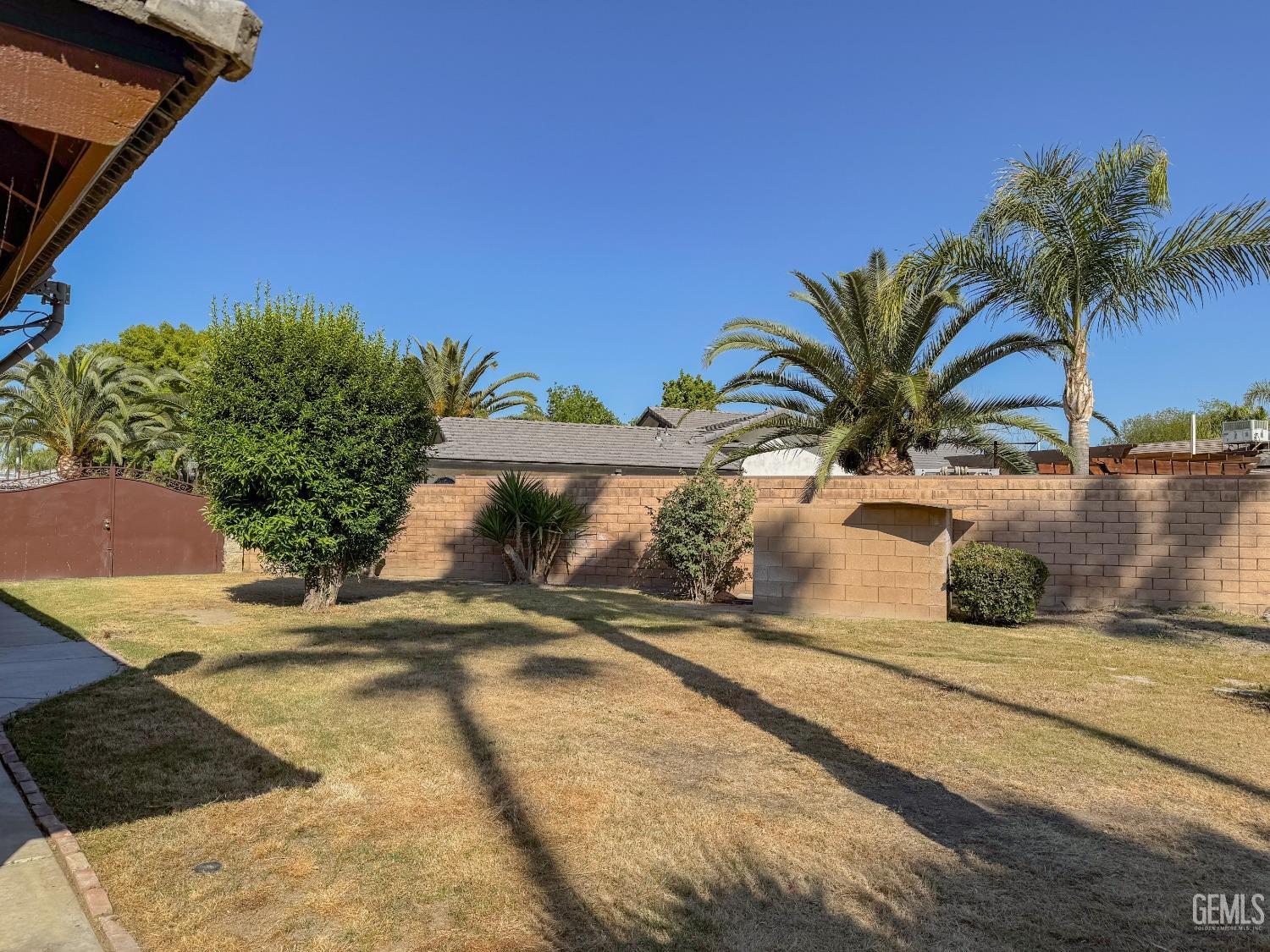 Undisclosed Address Bakersfield, CA 93307 - Photo 42 of 46 a view of a yard with a plant