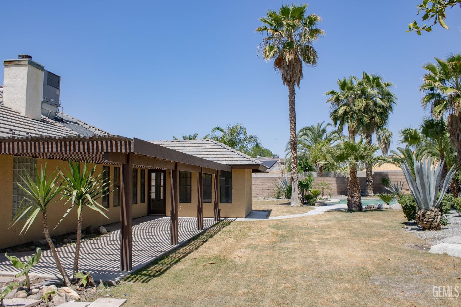 Undisclosed Address Bakersfield, CA 93307 - Photo 43 of 46 a front view of a house with garden