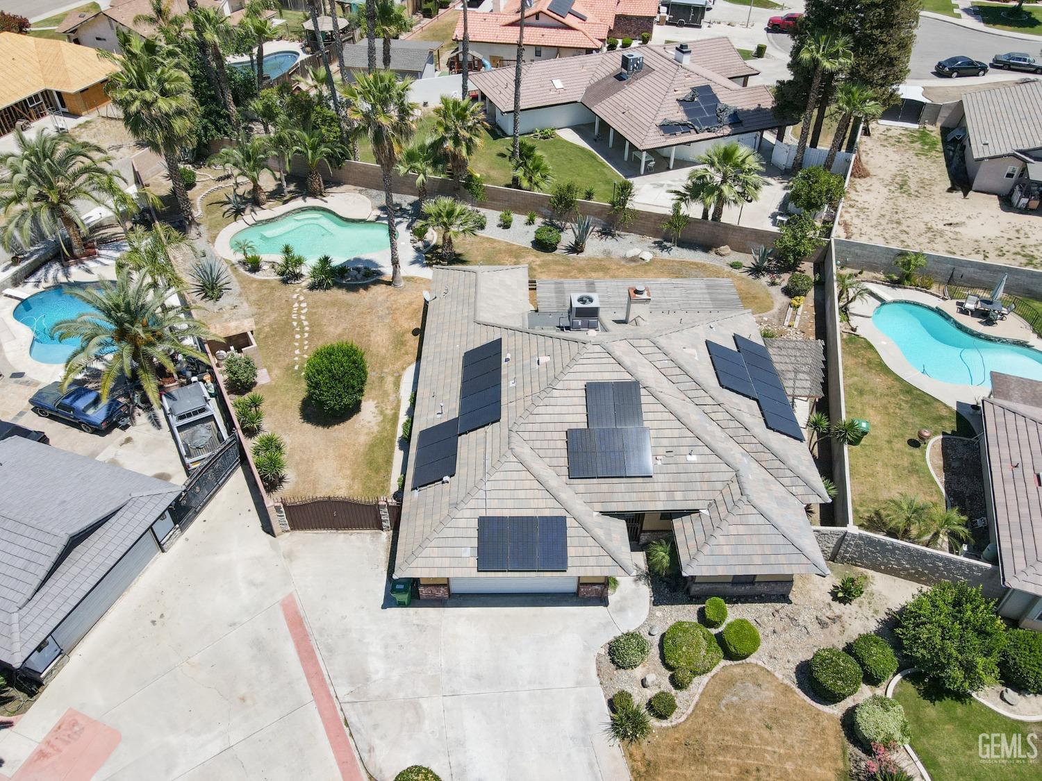 Undisclosed Address Bakersfield, CA 93307 - Photo 44 of 46 an aerial view of residential houses with outdoor space and parking