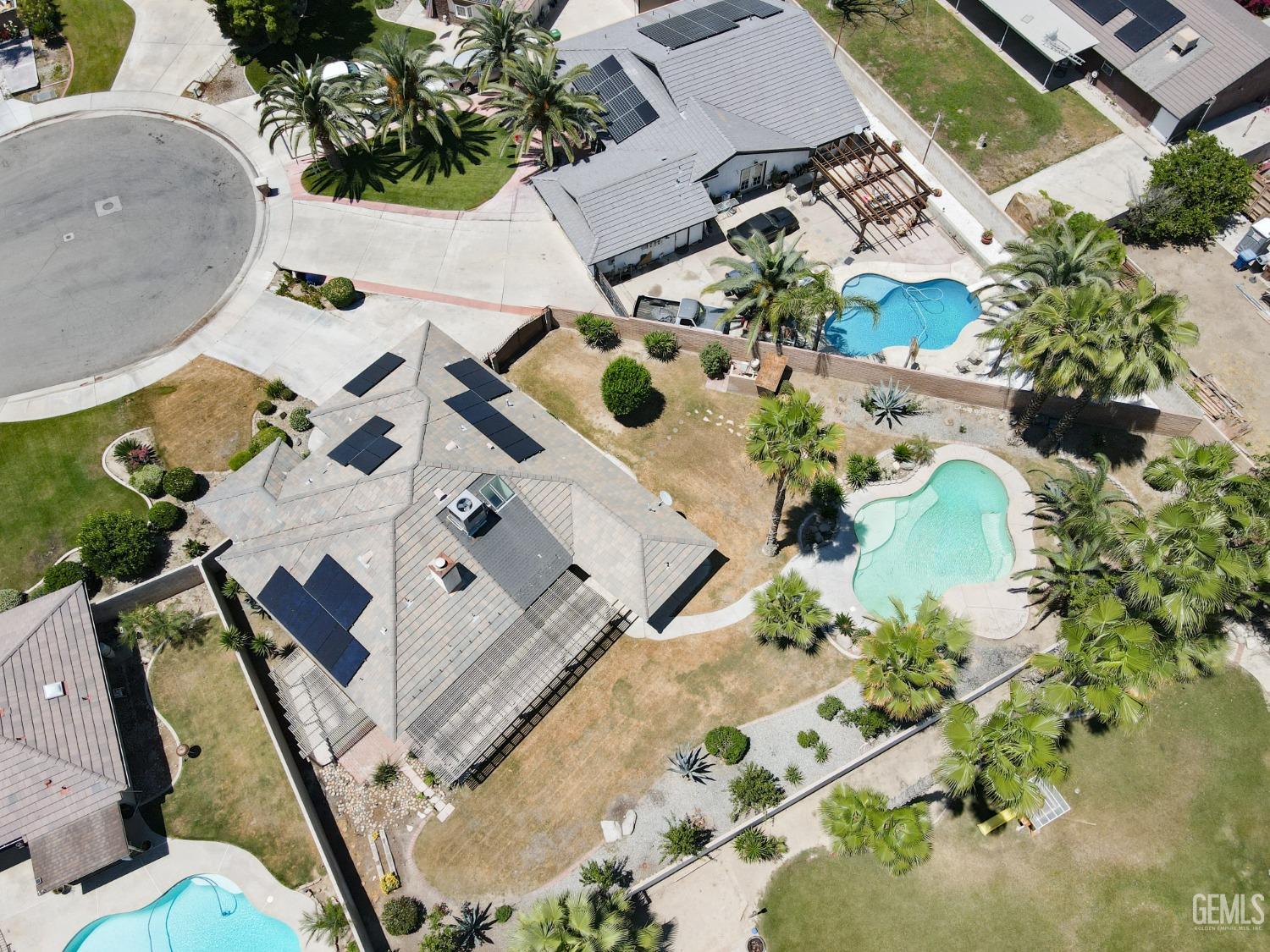 Undisclosed Address Bakersfield, CA 93307 - Photo 45 of 46 an aerial view of a house with a yard and a wooden deck