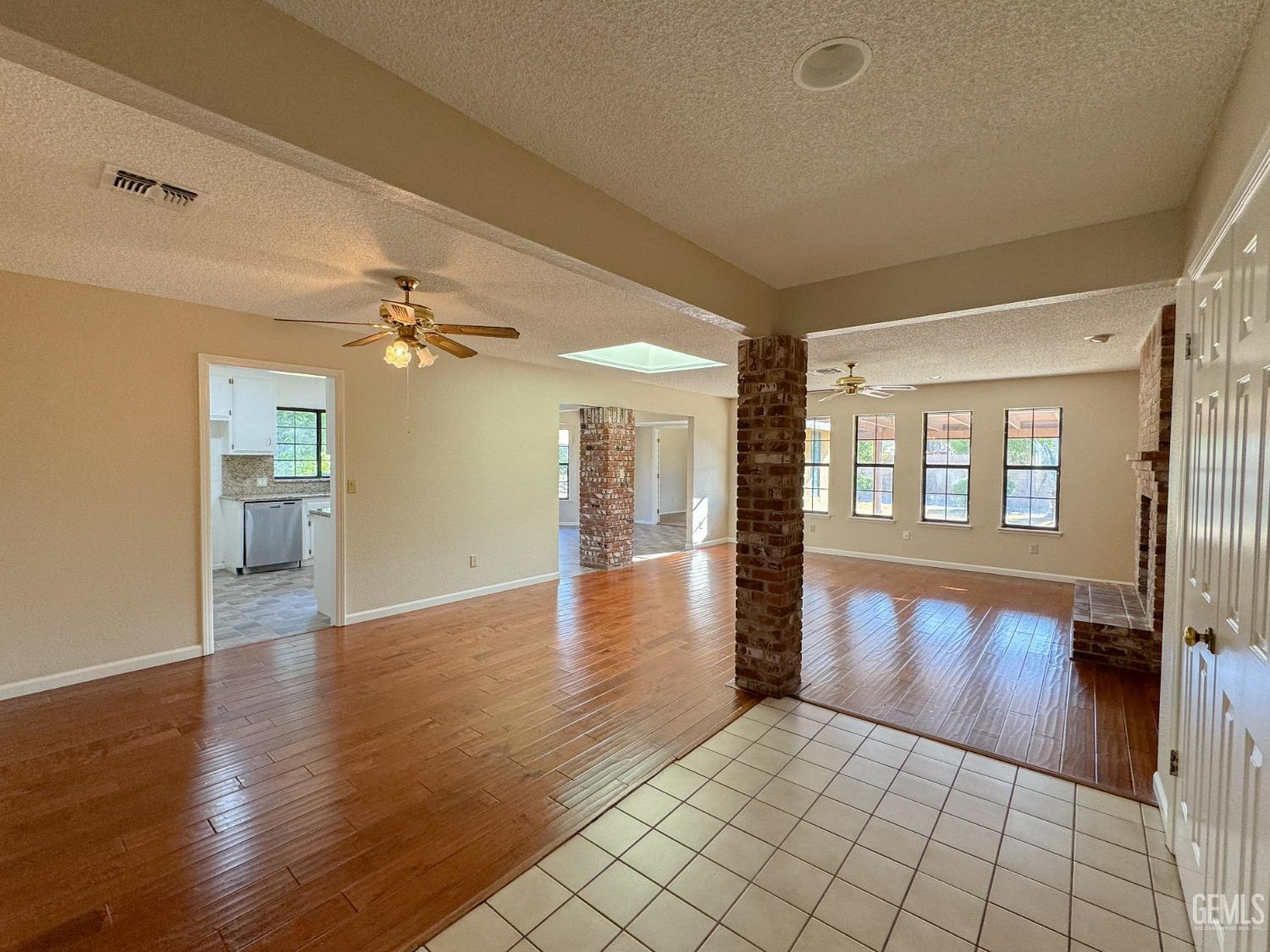 Undisclosed Address Bakersfield, CA 93307 - Photo 5 of 46 a view of an entryway with wooden floor and a living room