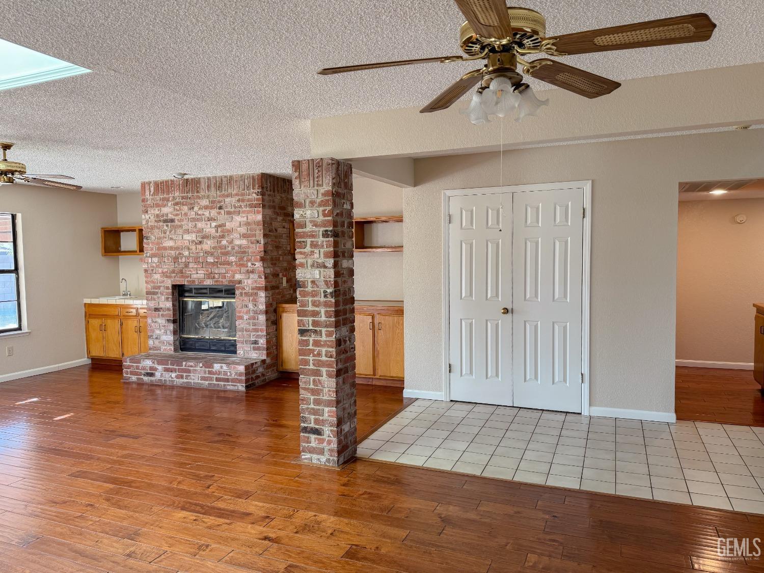 Undisclosed Address Bakersfield, CA 93307 - Photo 7 of 46 a view of a livingroom with furniture and a ceiling fan