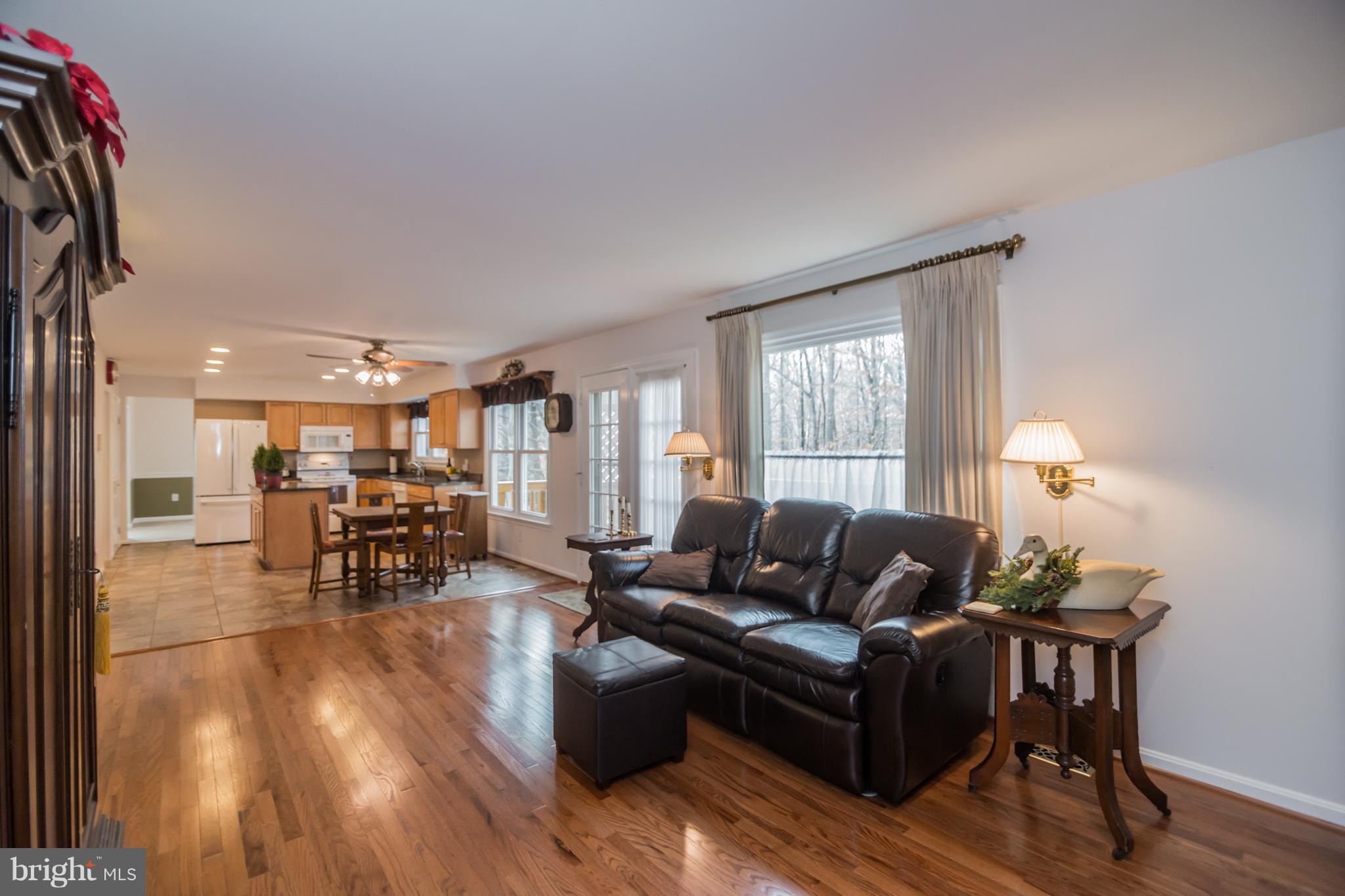 13016 Smoketown Road Woodbridge, VA 22192 - Photo 11 of 30 a living room with furniture and wooden floor