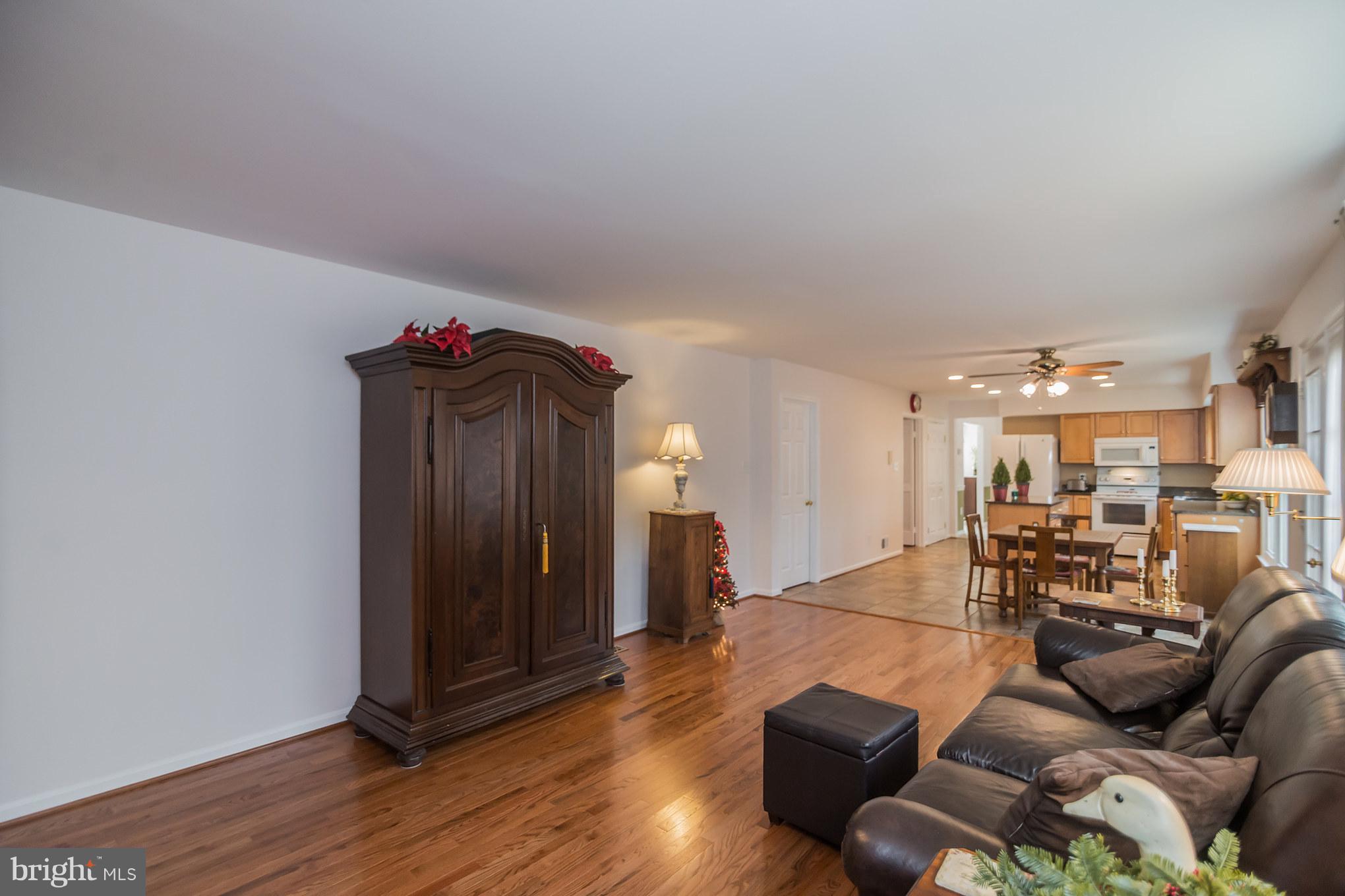 13016 Smoketown Road Woodbridge, VA 22192 - Photo 13 of 30 a living room with furniture and wooden floor
