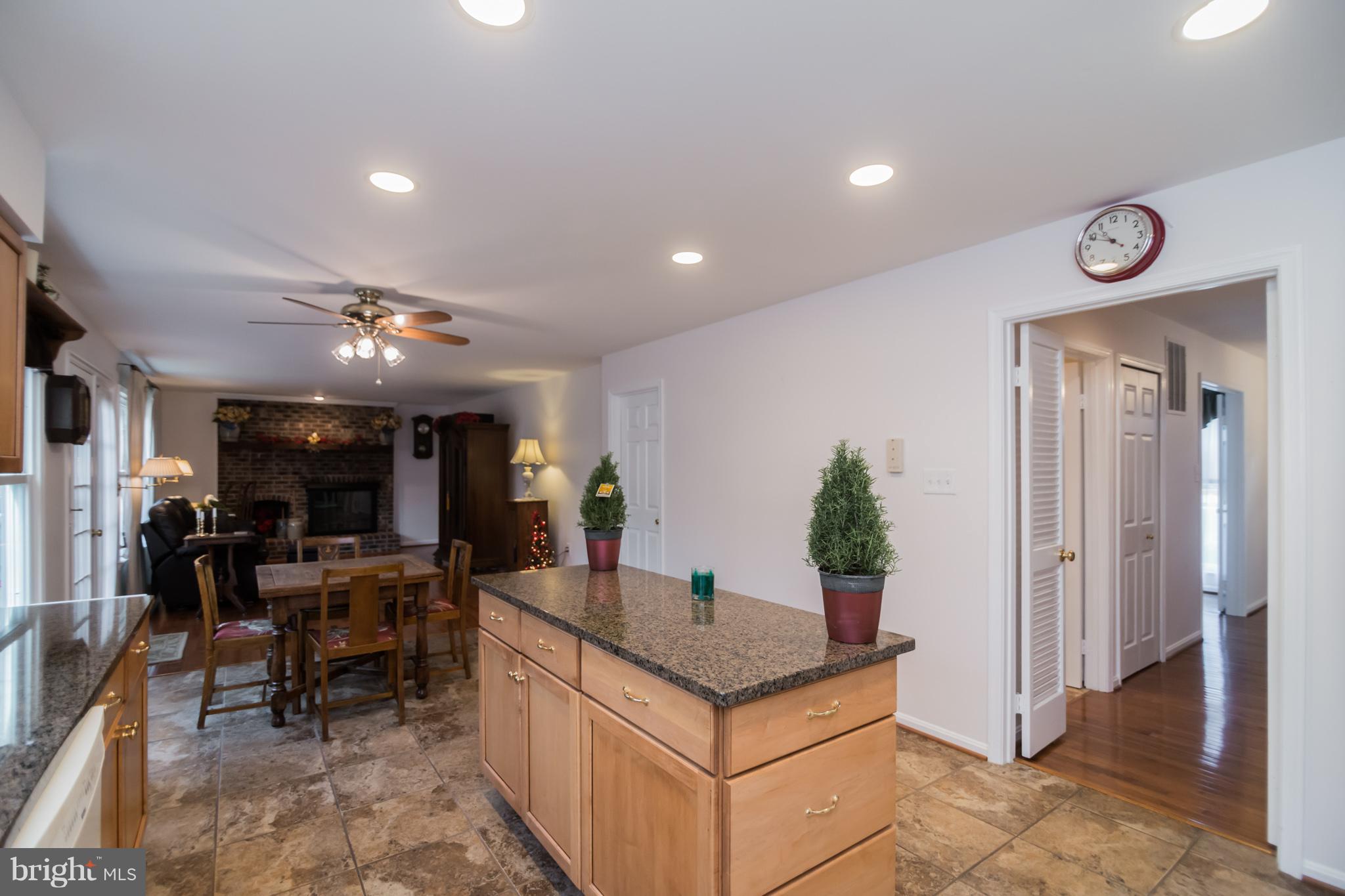 13016 Smoketown Road Woodbridge, VA 22192 - Photo 14 of 30 a kitchen with stainless steel appliances granite countertop a sink and a refrigerator