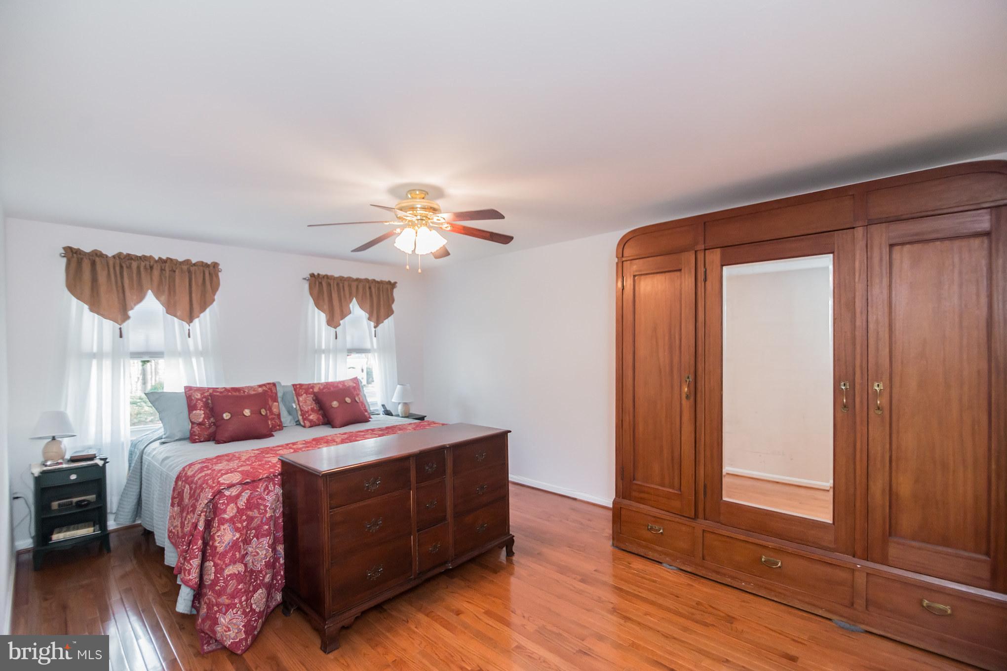 13016 Smoketown Road Woodbridge, VA 22192 - Photo 21 of 30 a bedroom with a bed and a window
