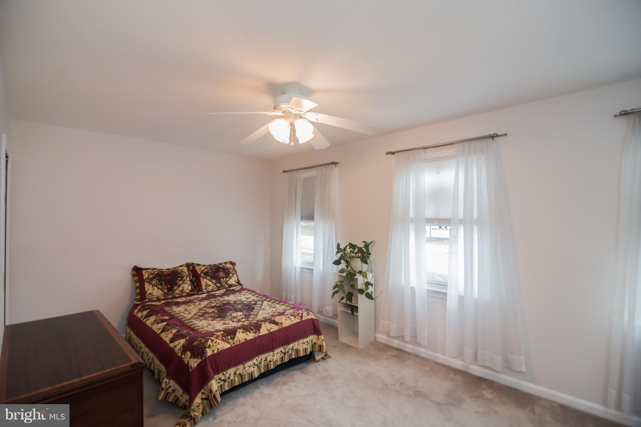 13016 Smoketown Road Woodbridge, VA 22192 - Photo 26 of 30 a living room with furniture and a chandelier