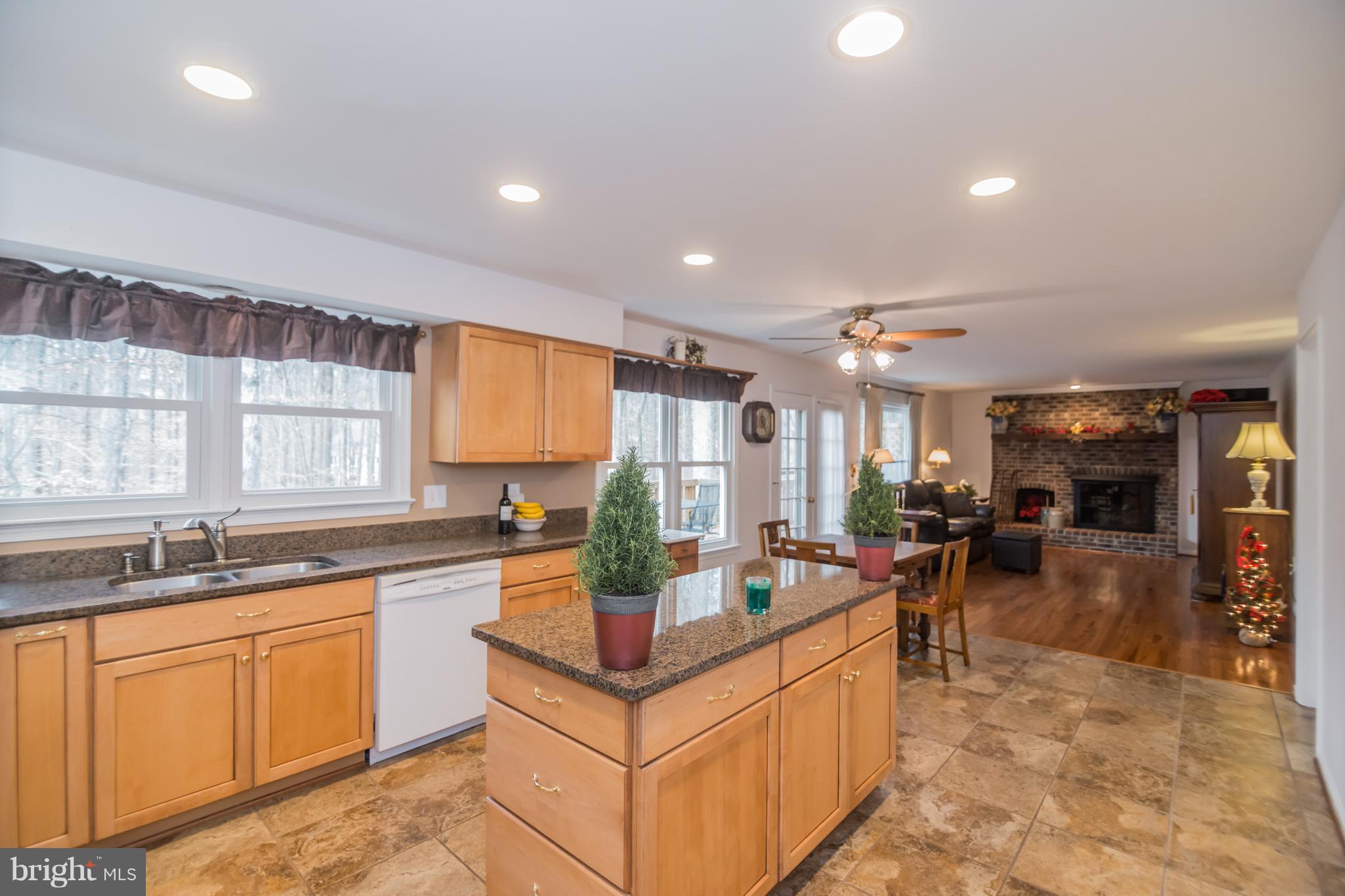 13016 Smoketown Road Woodbridge, VA 22192 - Photo 6 of 30 a kitchen with sink stove and cabinets