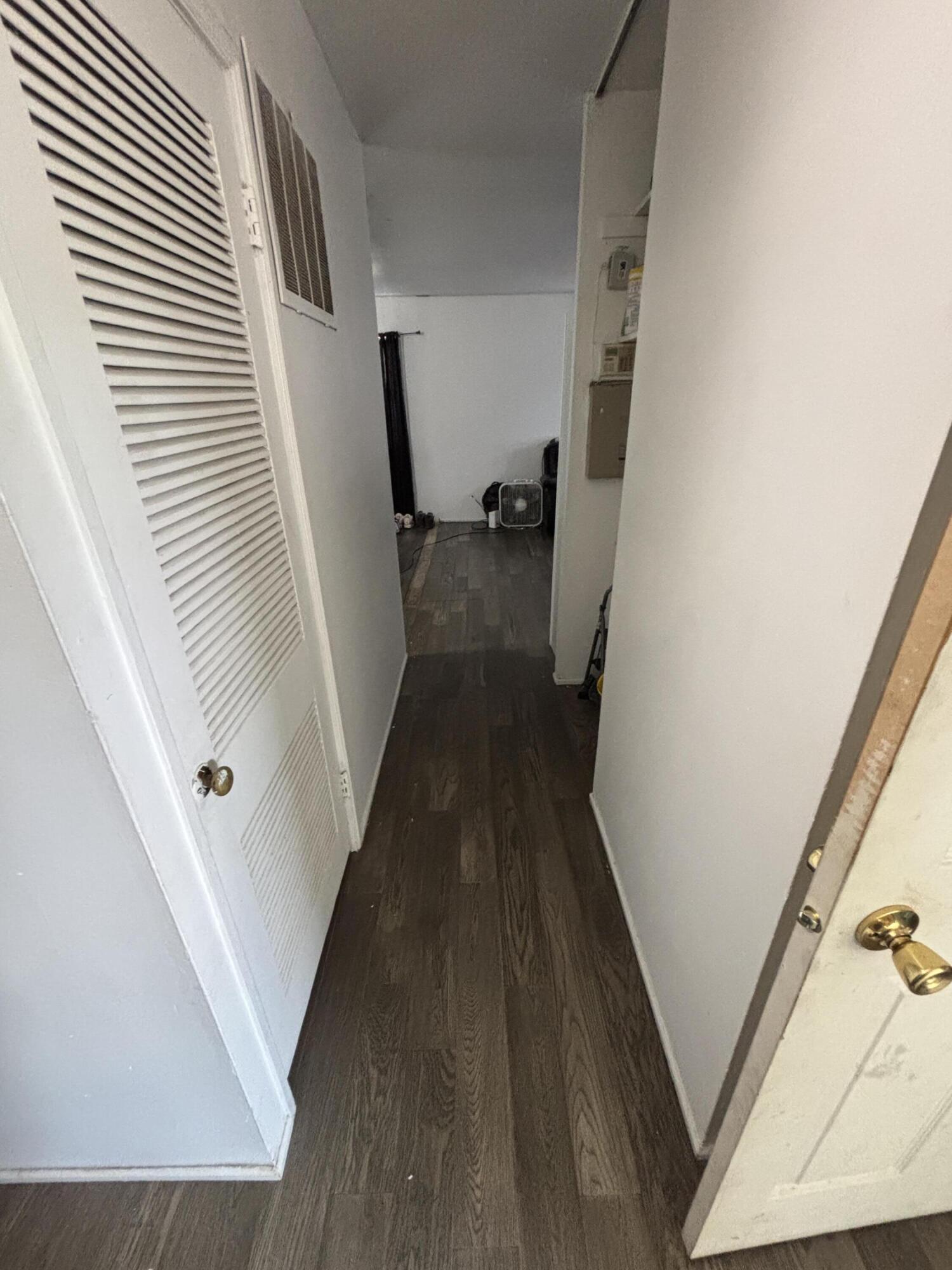 2154 Whitcomb Street Gary, IN 46404 - Photo 12 of 12 a view of a hallway with wooden floor and staircase