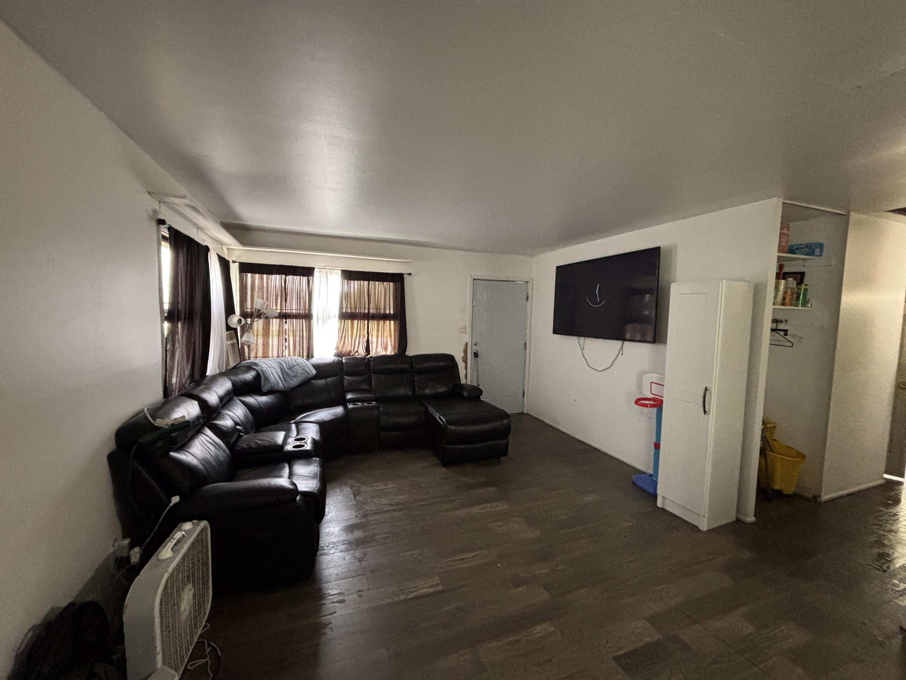 2154 Whitcomb Street Gary, IN 46404 - Photo 2 of 12 a living room with furniture and a flat screen tv