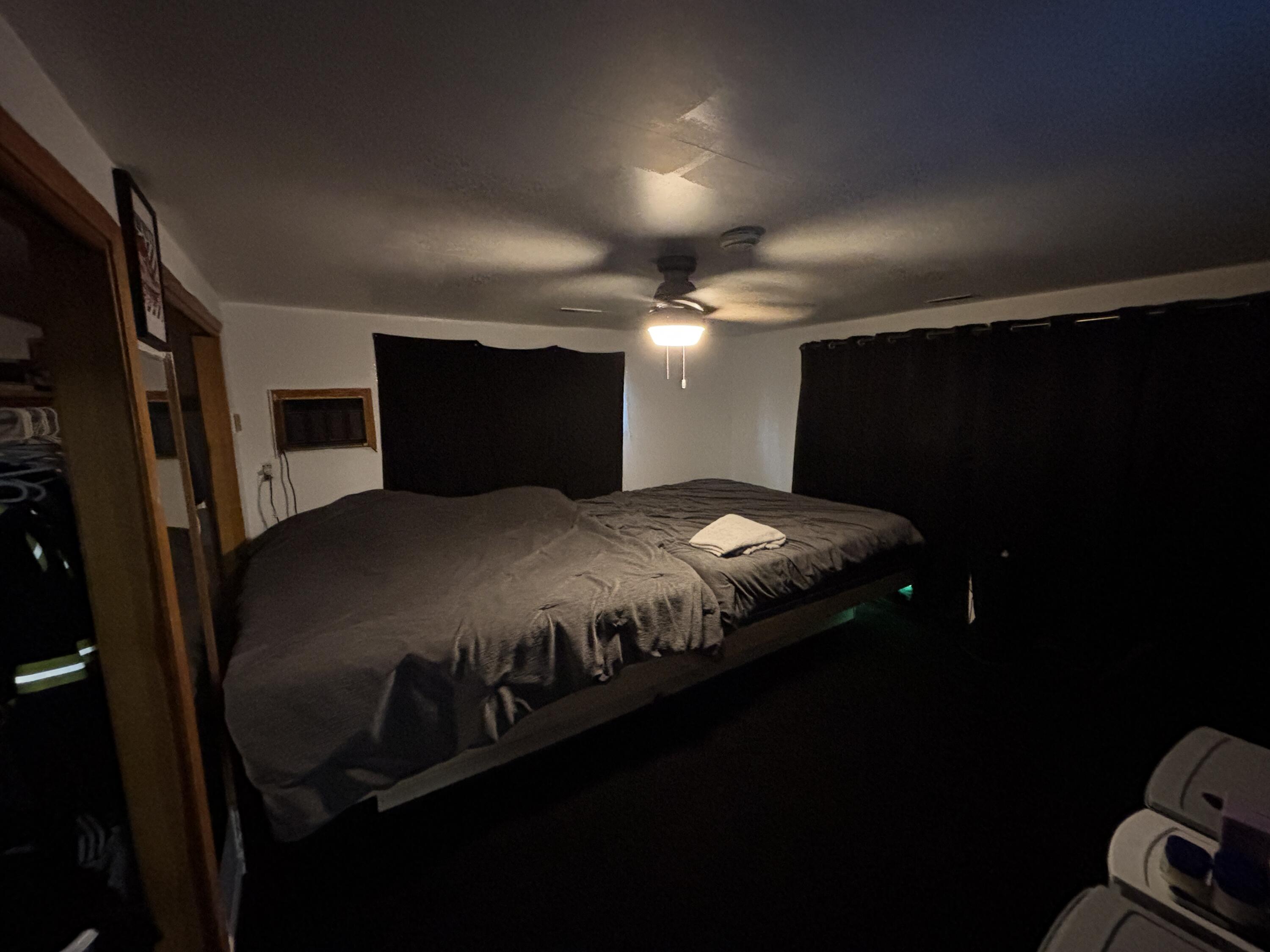 2154 Whitcomb Street Gary, IN 46404 - Photo 6 of 12 a bed sitting in a room next to a room