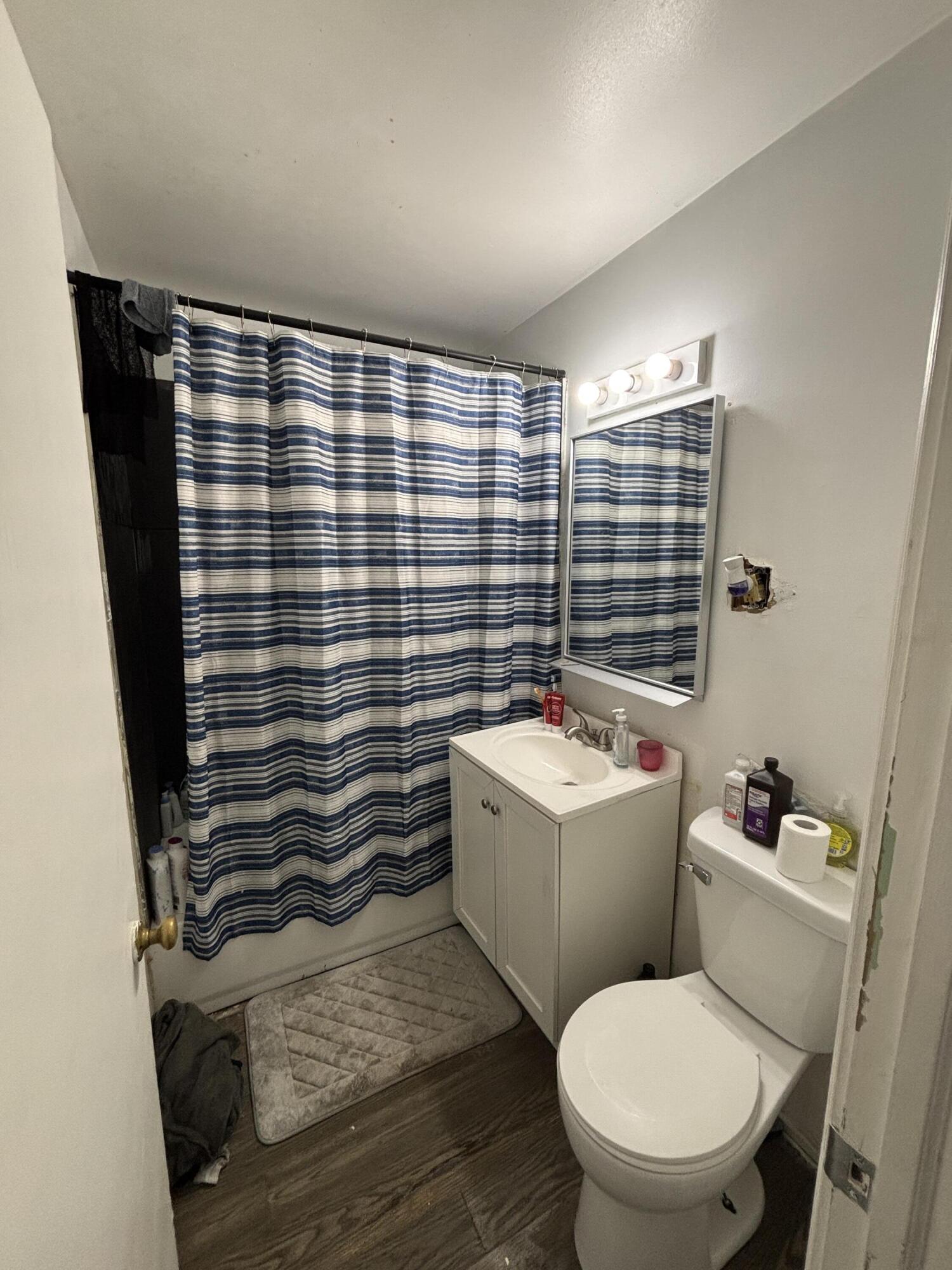 2154 Whitcomb Street Gary, IN 46404 - Photo 9 of 12 a bathroom with a toilet a sink and bathtub