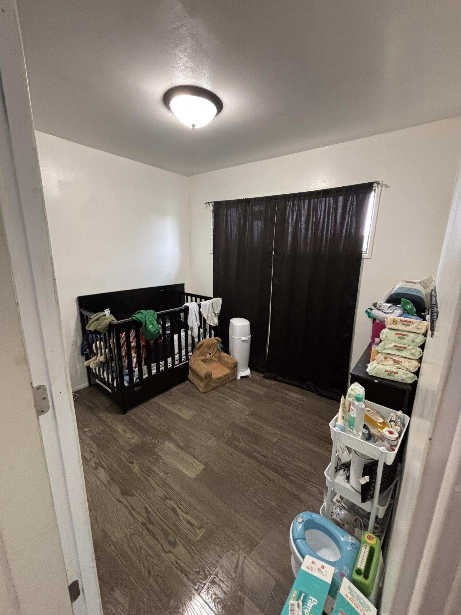 2154 Whitcomb Street Gary, IN 46404 - Photo 10 of 12 a living room with furniture a rug and a window
